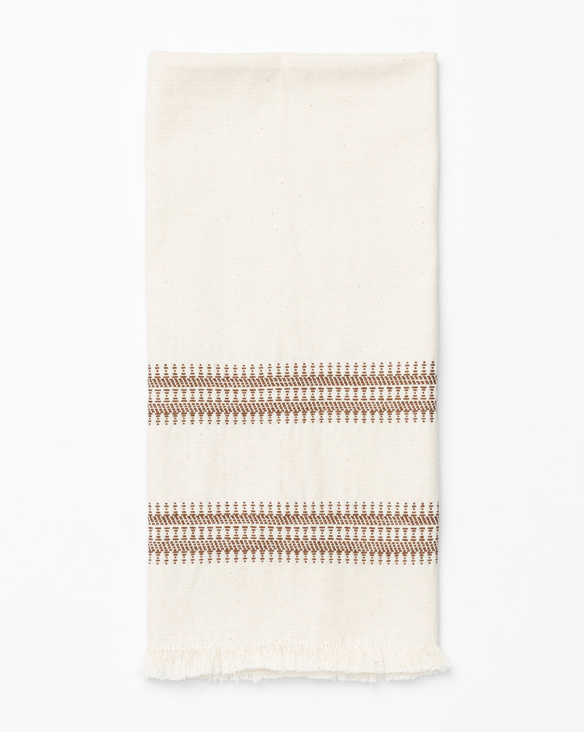 The Woven Stripe Tea Towel features cream cotton with two brown geometric stripes near one end and a short fringe at the bottom—a stylish, textured accent for your kitchen, by McGee & Co.
