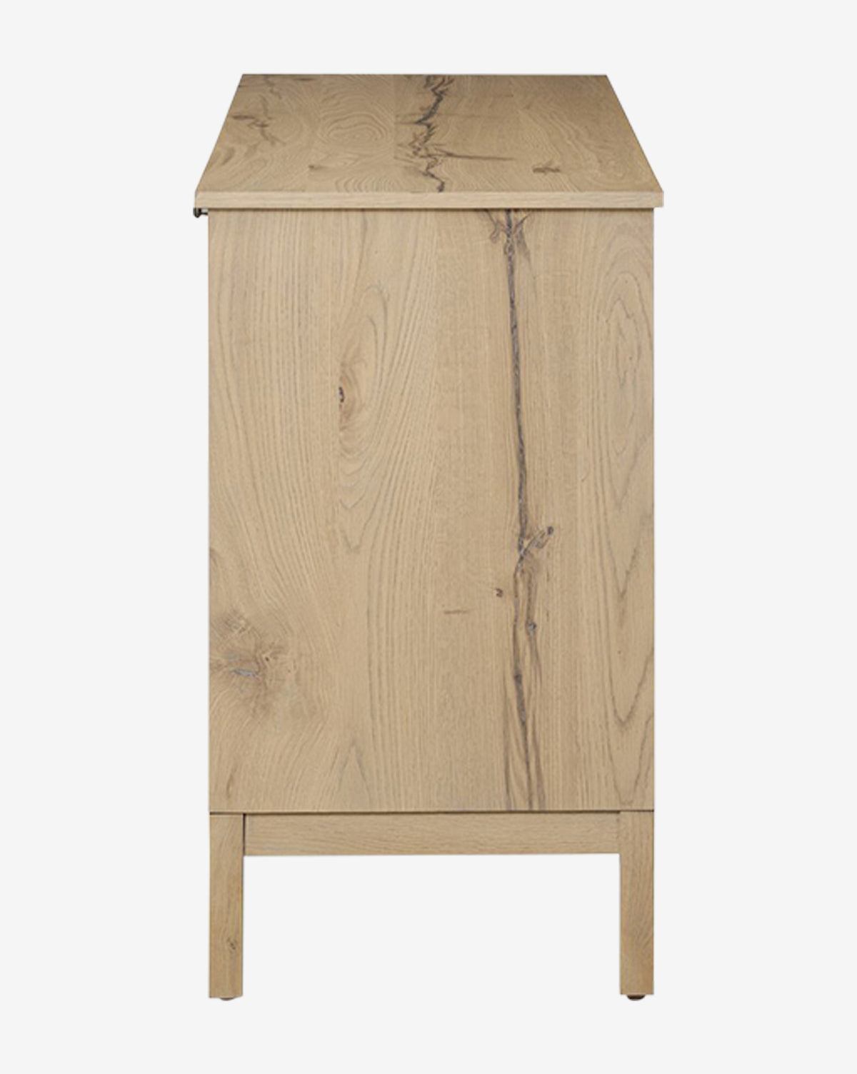 Side view of the Wynne Sideboard, featuring light solid oak with a visible natural grain, minimalist legs, and a flat top, by McGee & Co. Its modern, minimal design is shown against a white background.