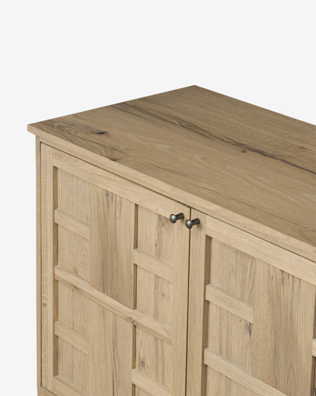 The Wynne Sideboard is a solid oak storage unit with a natural finish, showcasing geometric square-patterned doors and two small round metal handles, by McGee & Co.