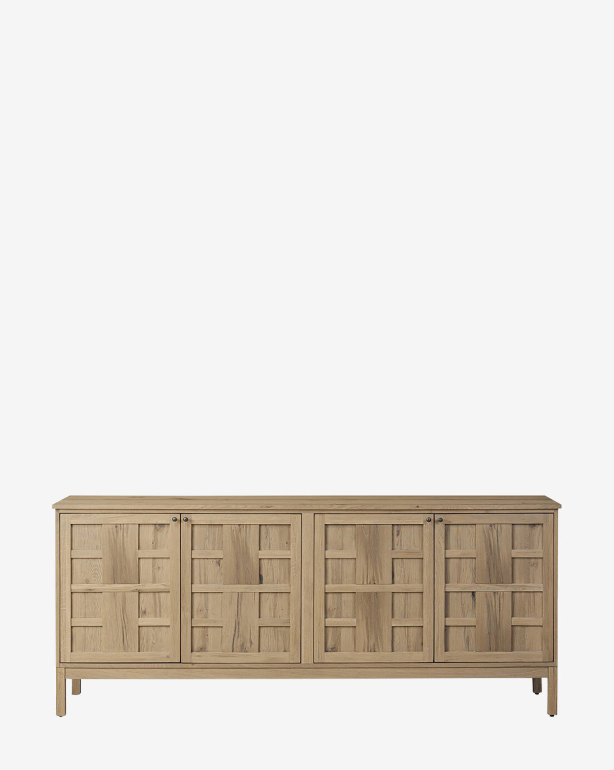 The Wynne Sideboard features four cabinet doors with geometric panels, straight legs, and a natural oak finish, making this light wood storage piece ideal for modern spaces, by McGee & Co.