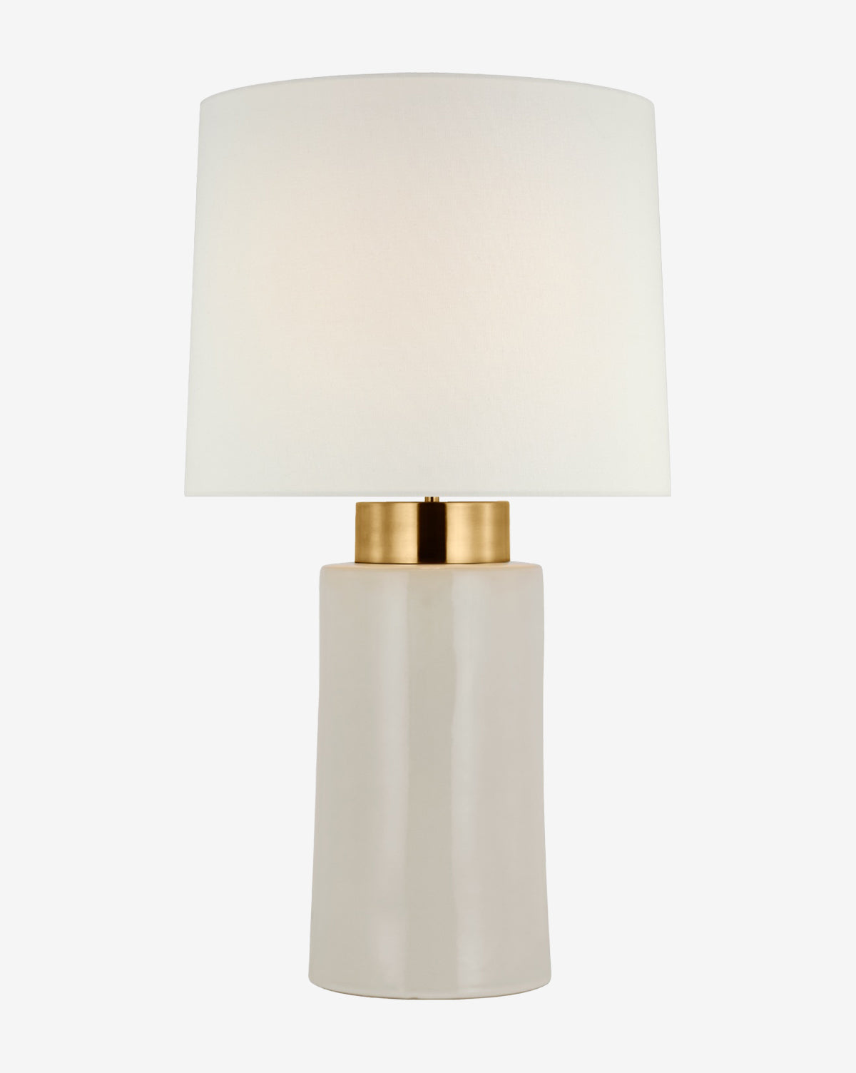 The Xian Table Lamp by Visual Comfort & Co. Signature features a modern white cylindrical ceramic base with a gold accent, topped with a large white linen shade. McGee & Co.