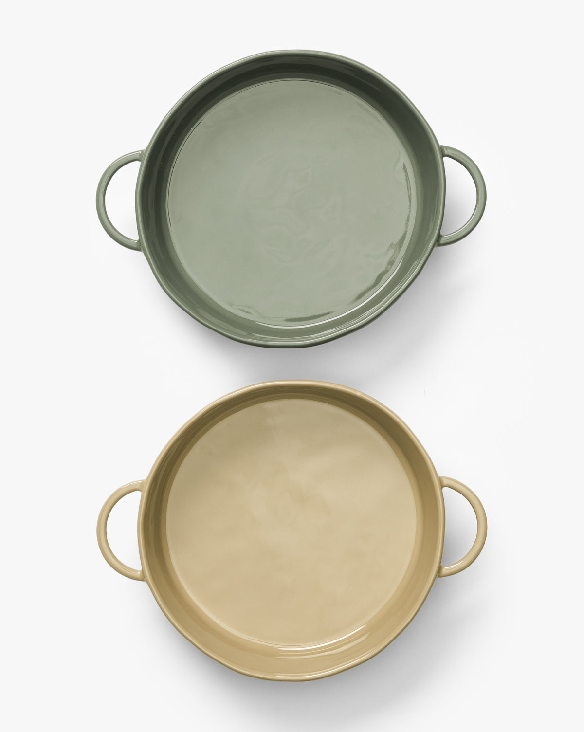 The 2 Quart Stoneware Baker Set of 2 features round bakers with handles—one in sage green and one in beige—arranged vertically on a white background, by McGee & Co.