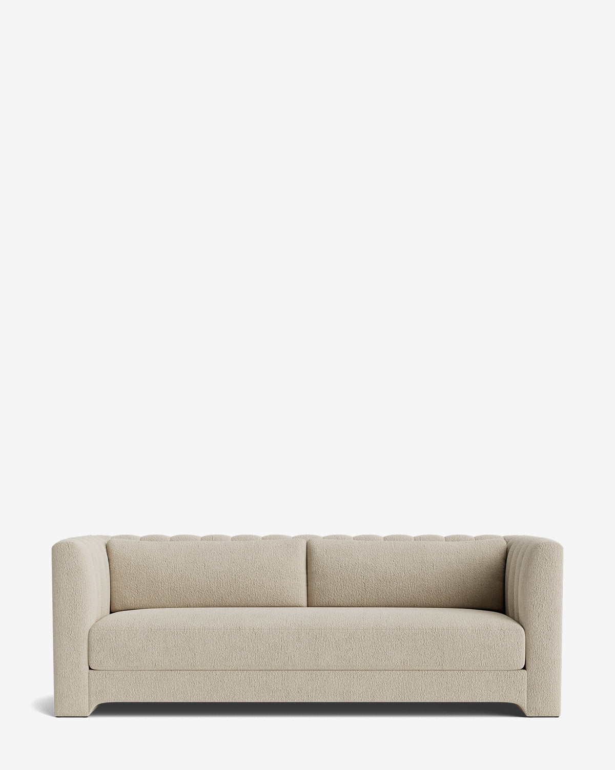 The Agatha Sofa 90 is a modern, light beige handcrafted sofa with a tufted backrest and rounded arms, displayed against a plain white background, by McGee & Co.