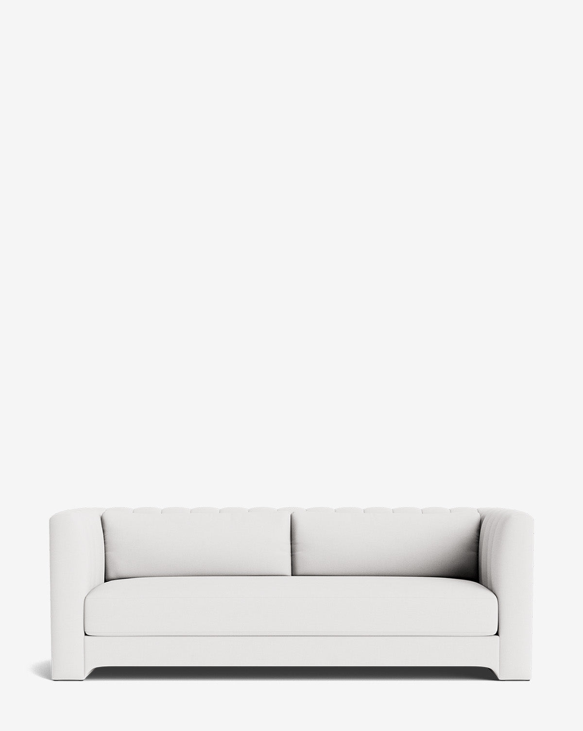The Agatha Sofa 90 is a modern, handcrafted sofa in white, featuring a tufted backrest and curved arms, set against a plain white background, by McGee & Co.