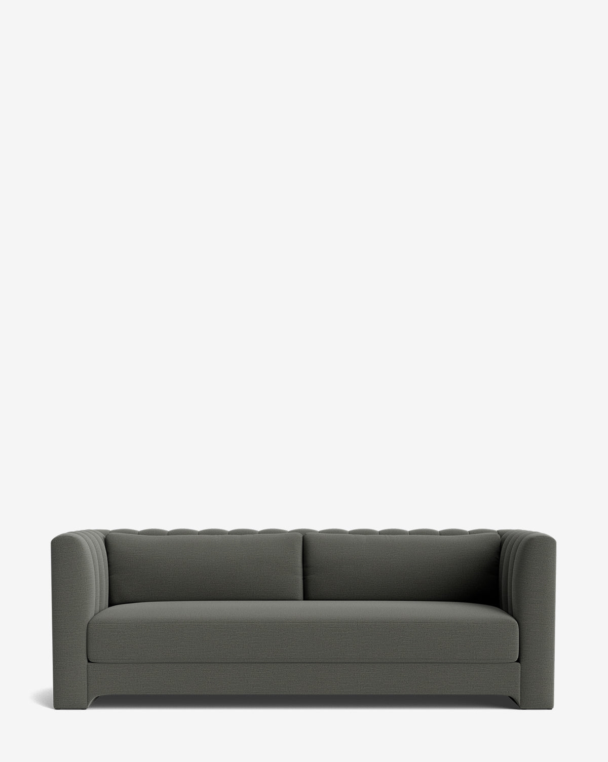A modern, dark gray handcrafted Agatha Sofa 90 with two seat cushions, rounded arms, and a tufted backrest, shown against a plain white background by McGee & Co.