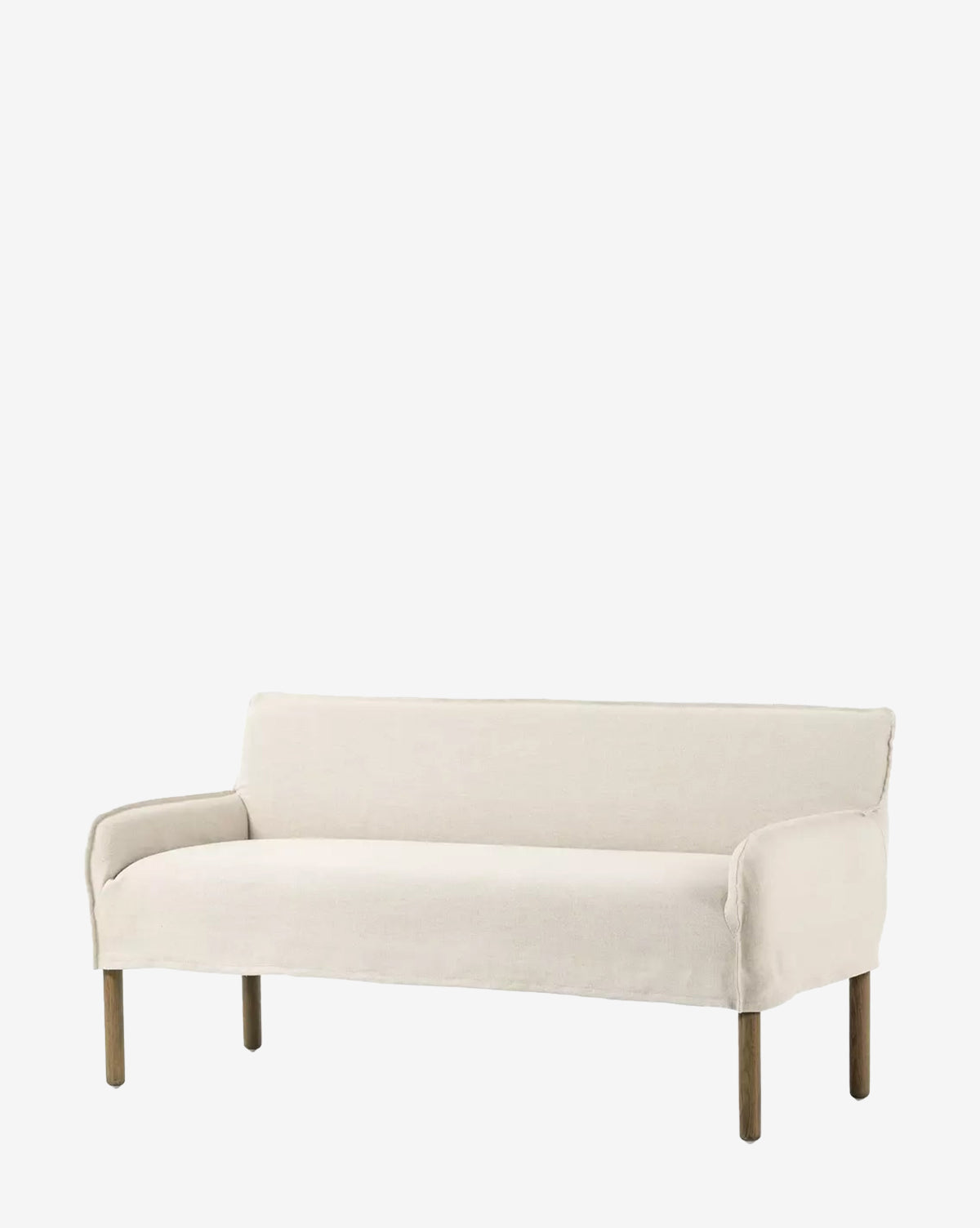 The Aiken Slipcover Bench is a minimalist beige seat with wooden legs and a cushioned surface, designed with clean lines and a low backrest, shown on a plain white background by McGee & Co.