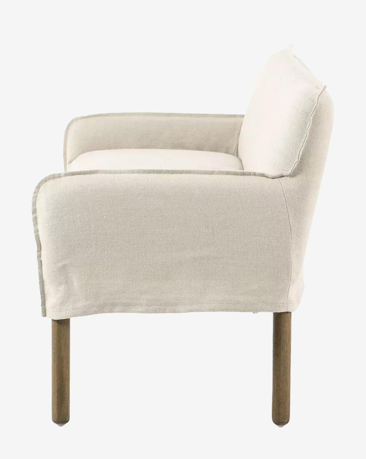 Side view of the Aiken Slipcover Bench with linen upholstery and wooden legs, featuring a cushioned seat, clean lines, and a simple, minimalist design, by McGee & Co.