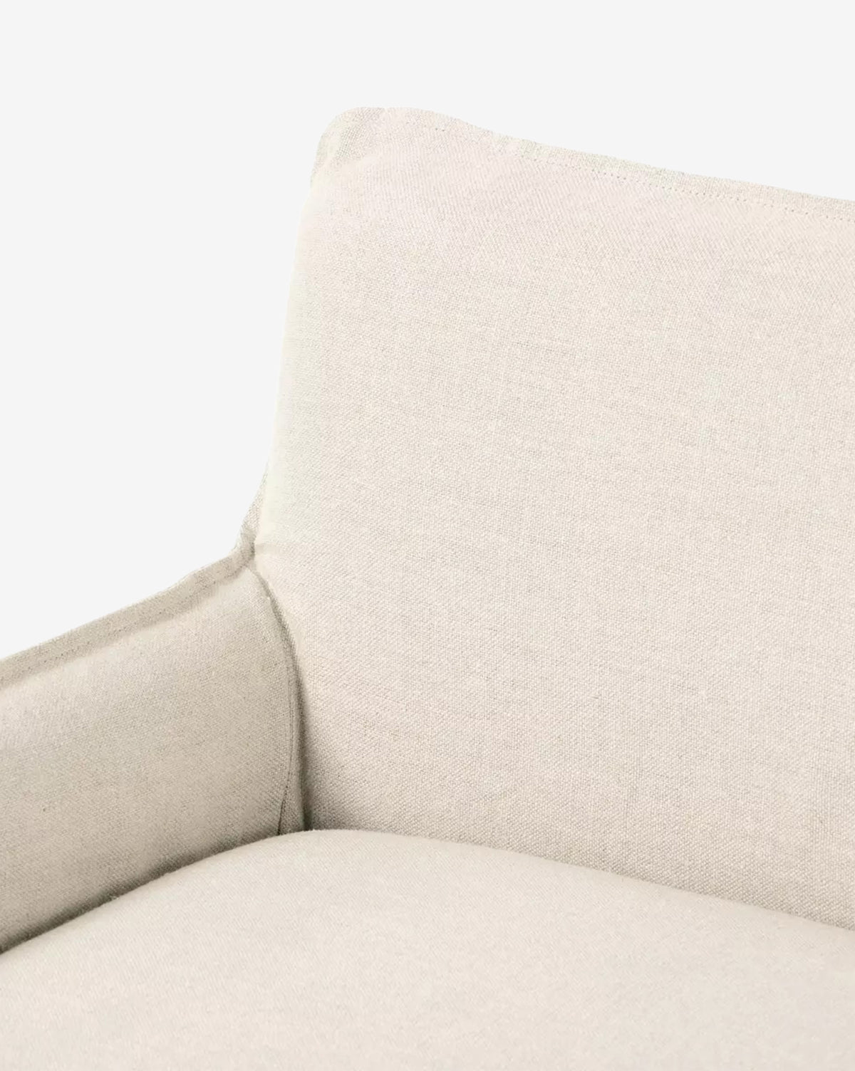 Close-up view of the Aiken Slipcover Bench in light beige linen, highlighting its backrest, seat, and part of the armrest against a plain white background, by McGee & Co.