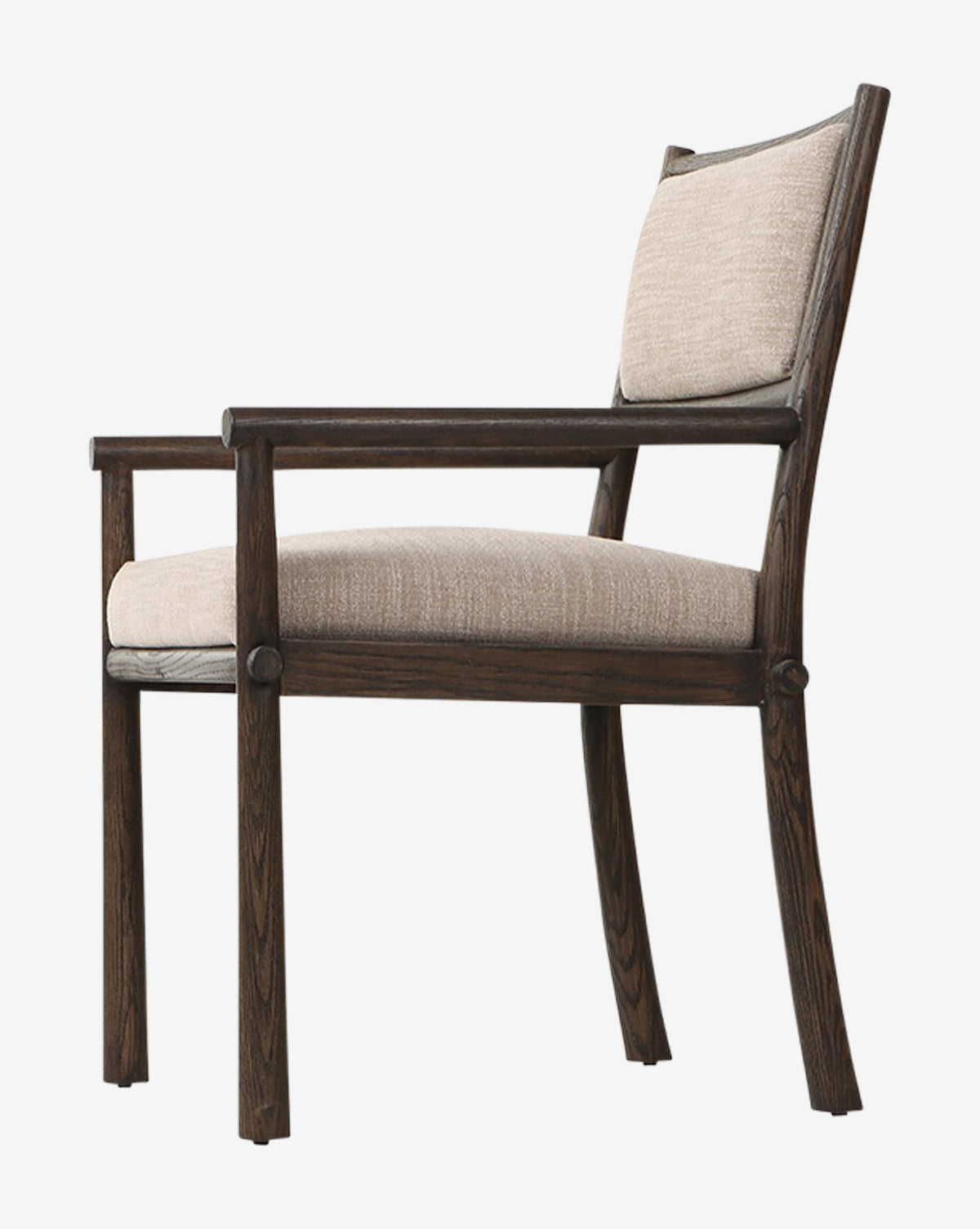 The Ailsa Dining Chair showcases a modern design with armrests, beige upholstered seat and backrest, and a dark brown oak frame, displayed from the side against a plain white background by McGee & Co.