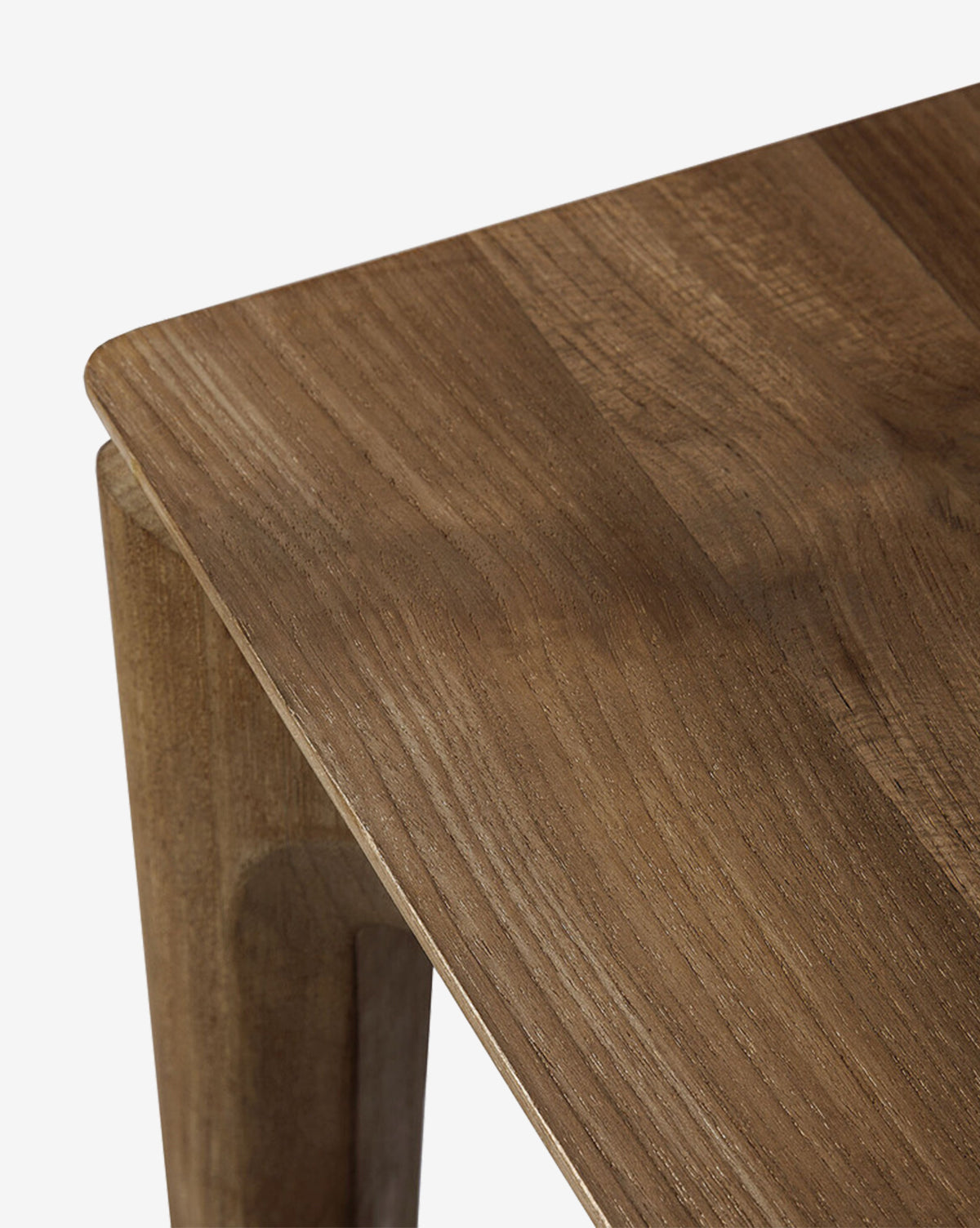 Close-up of the Alec Dining Table’s corner highlights its smooth finish and natural wood grain. The sturdy build and clean lines make this table an ideal choice for modern dining spaces, by McGee & Co.