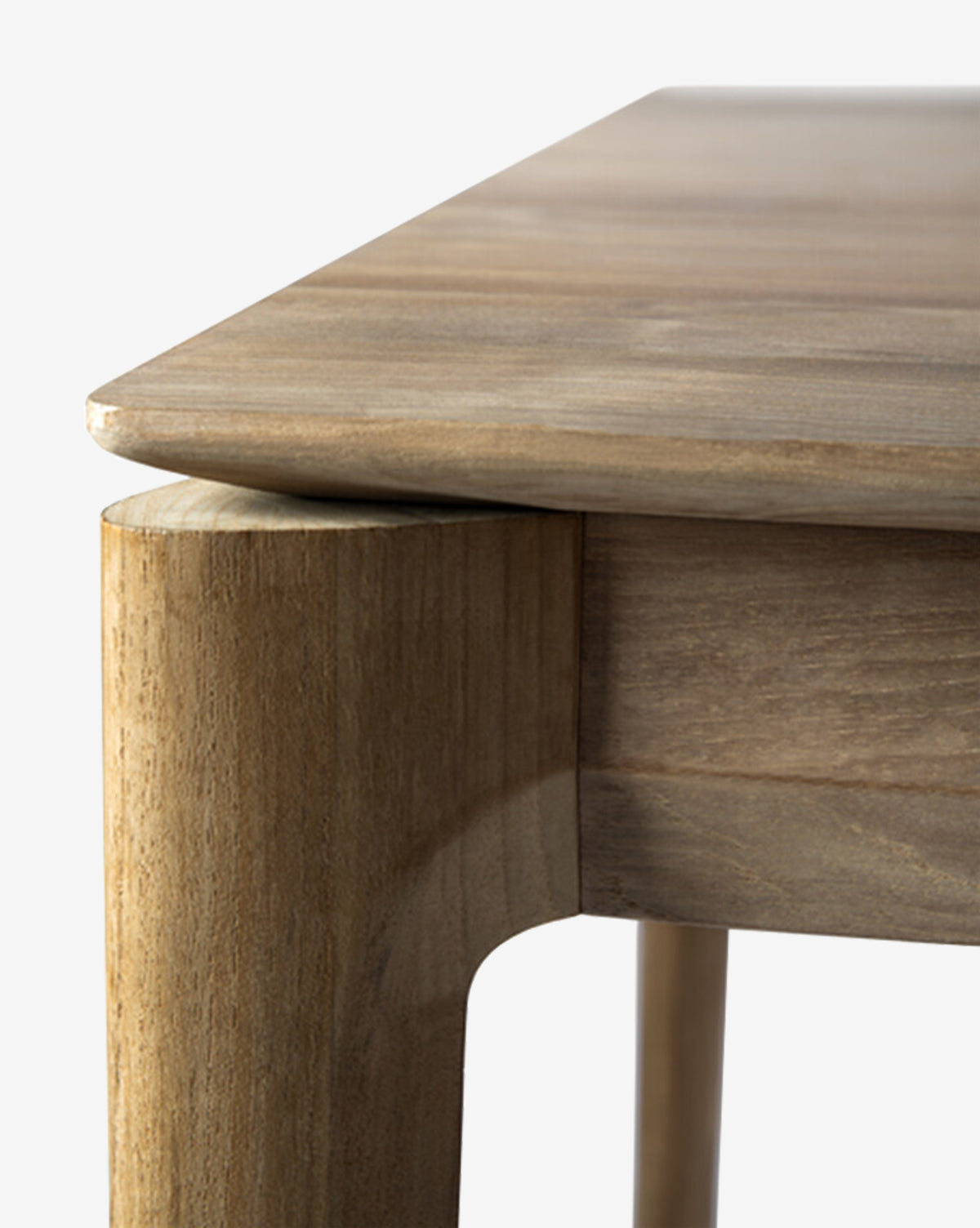 Close-up of the Alec Dining Table’s corner reveals rounded legs and a smooth, polished surface, highlighting its sturdy construction and natural wood grain—an expertly crafted piece for any dining room, by McGee & Co.