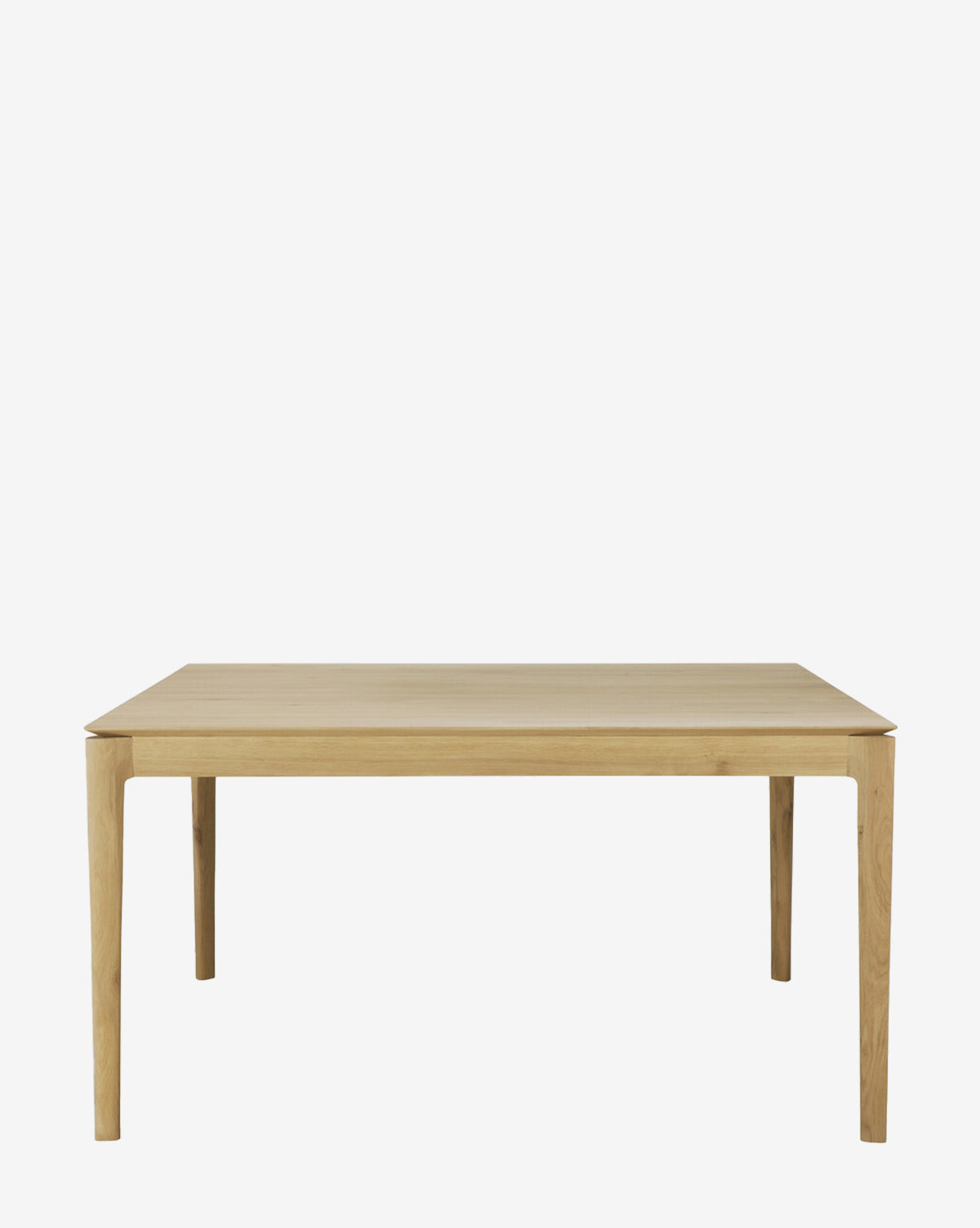 The Alec Dining Table features a minimalist, rectangular design with four straight legs and a light wood finish, offering sturdy construction ideal for any dining room, by McGee & Co. Shown against a plain white background.