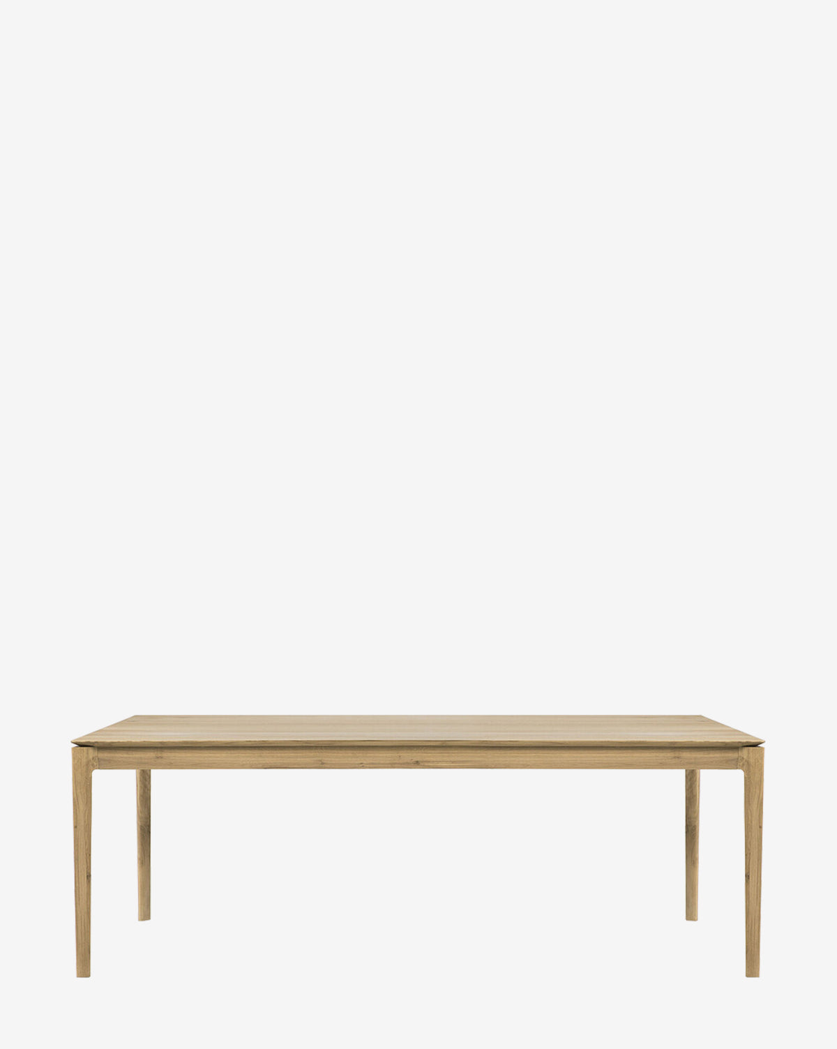 The Alec Dining Table showcases sturdy construction with a simple rectangular wooden design and four straight legs, making it a versatile addition to any dining room, by McGee & Co.