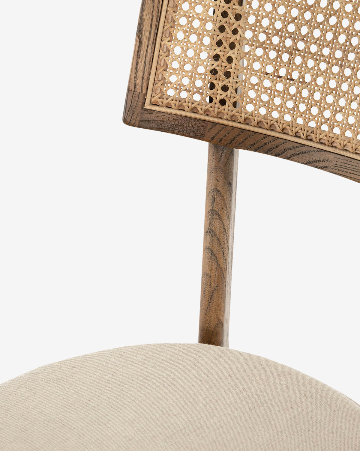 Close-up of the Alessia Stool, a wooden chair with a caned backrest and cushioned beige seat—ideal for retro or kitchen styling against a white background, by McGee & Co.