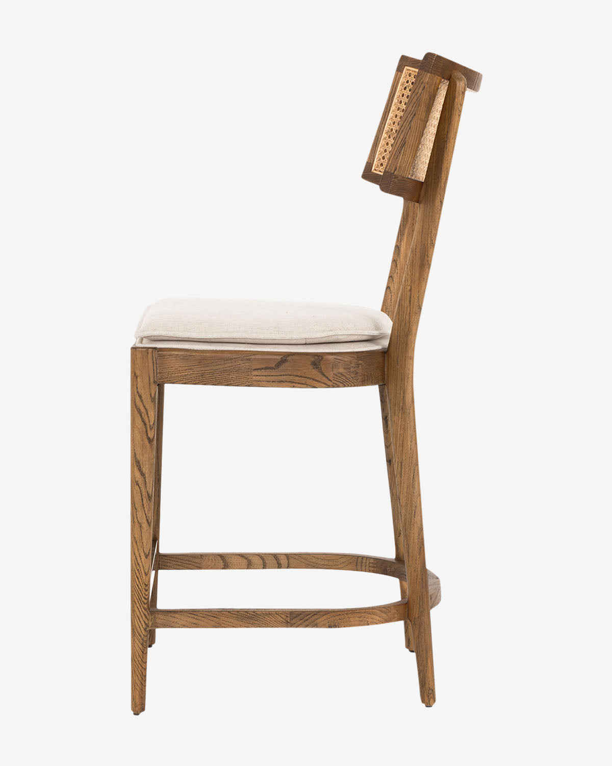 Side view of the Alessia Stool featuring a wooden frame, light-colored cushioned seat, caned backrest, and minimalist design—ideal for kitchen styling—set against a plain white background by McGee & Co.
