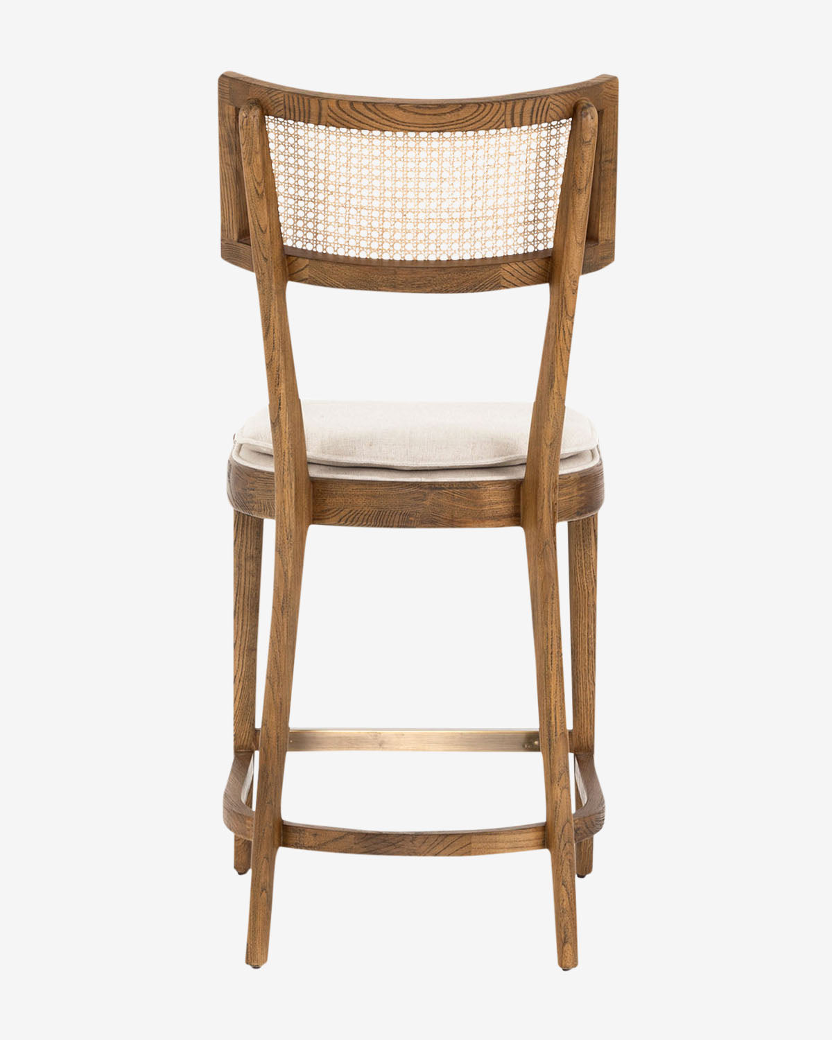 The Alessia Stool features a caned backrest, beige cushioned seat, and subtly curved legs—ideal for kitchen styling—shown from the back against a plain white background, by McGee & Co.