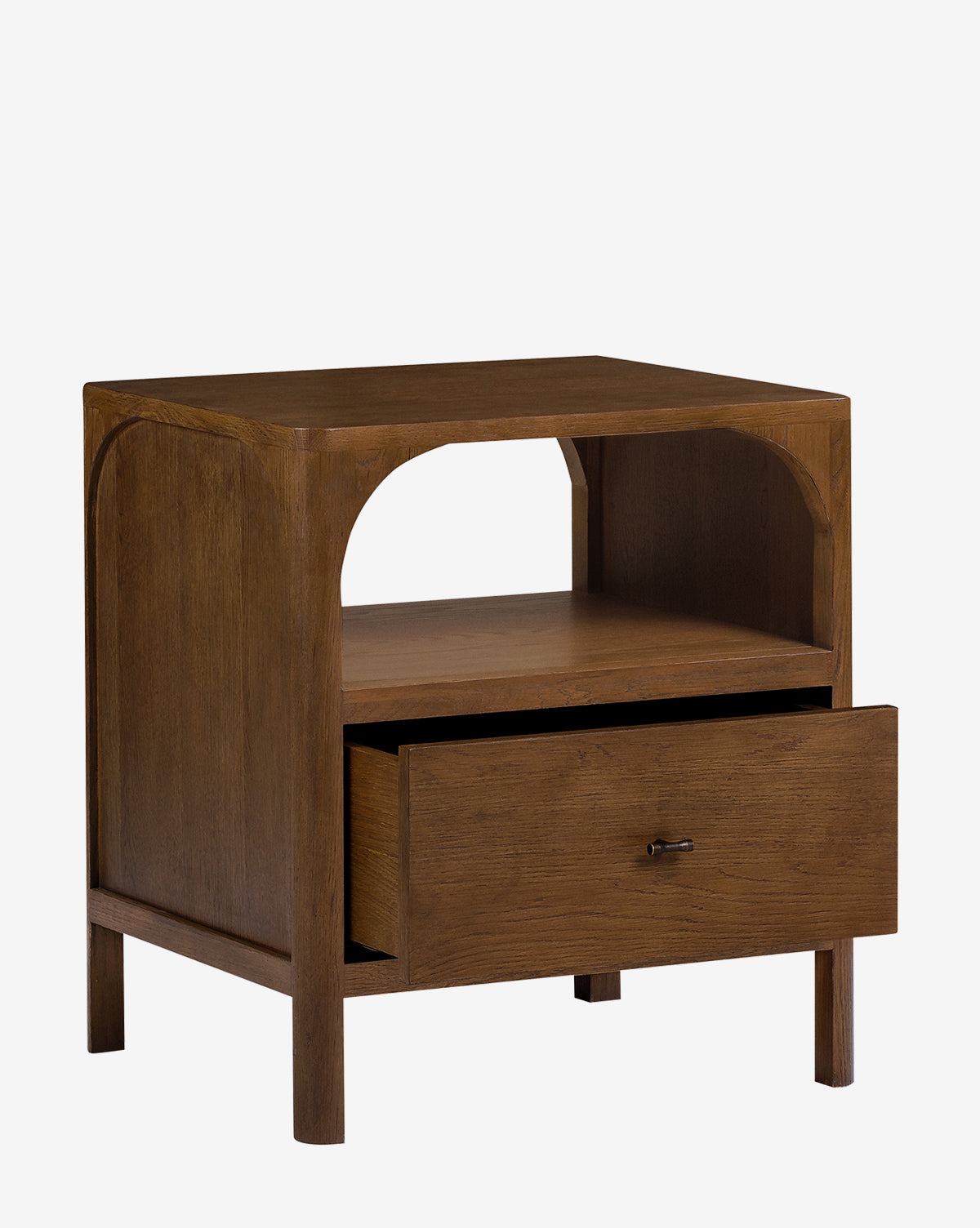 The Ambrosia Nightstand boasts a modern walnut oak veneer, an open shelf over a partially open single drawer, and is finished with elegant antique brass hardware, by McGee & Co.
