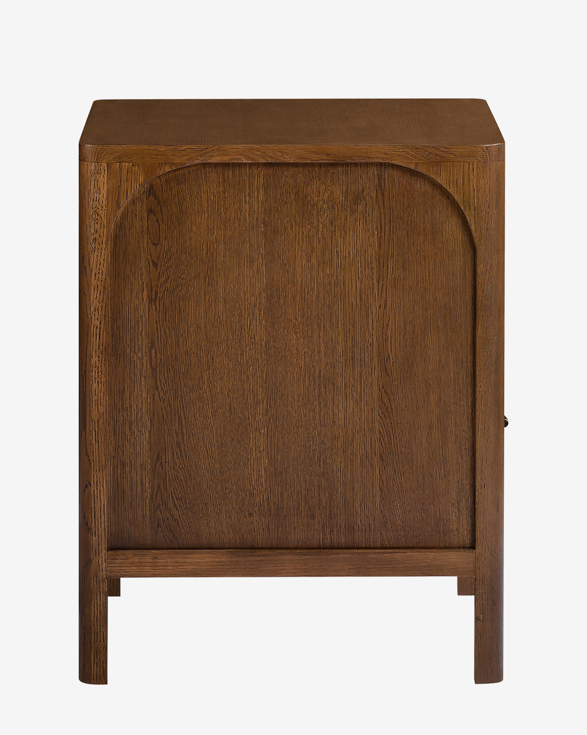 The Ambrosia Nightstand is a wooden cabinet with a rectangular shape, arched front panel detail, antique brass hardware, and stands on four short legs, by McGee & Co.