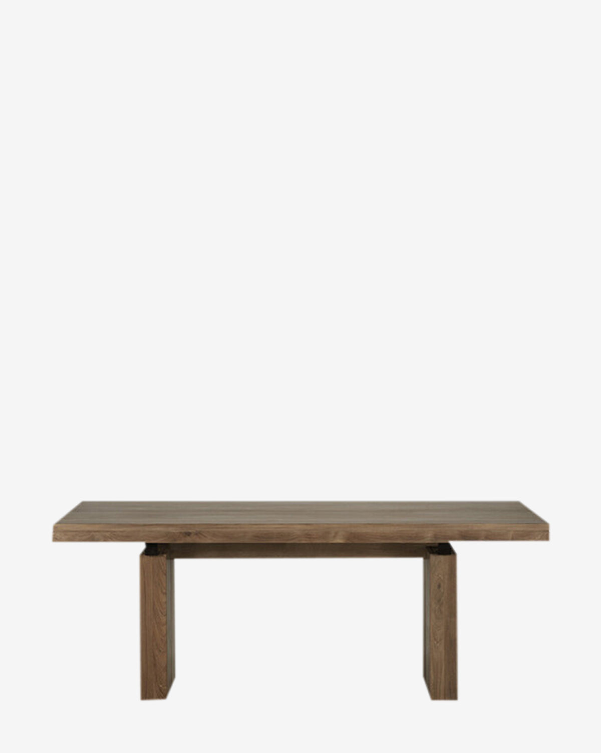 The Antoni Extension Dining Table features a rectangular solid wood design with a thick tabletop and wide, sturdy legs, showcased against a plain white background.
