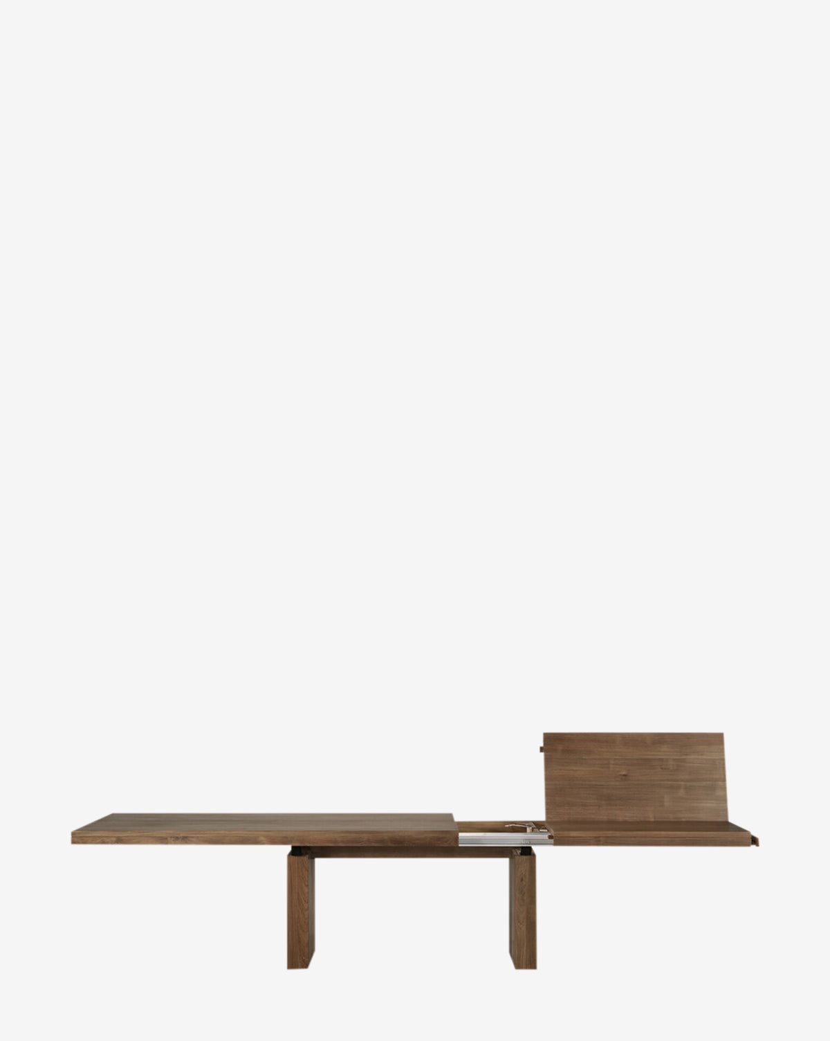 The Antoni Extension Dining Table features a modern solid wood rectangular top, shown partially extended with one leaf raised and two sturdy legs—an elegant addition to any dining space.