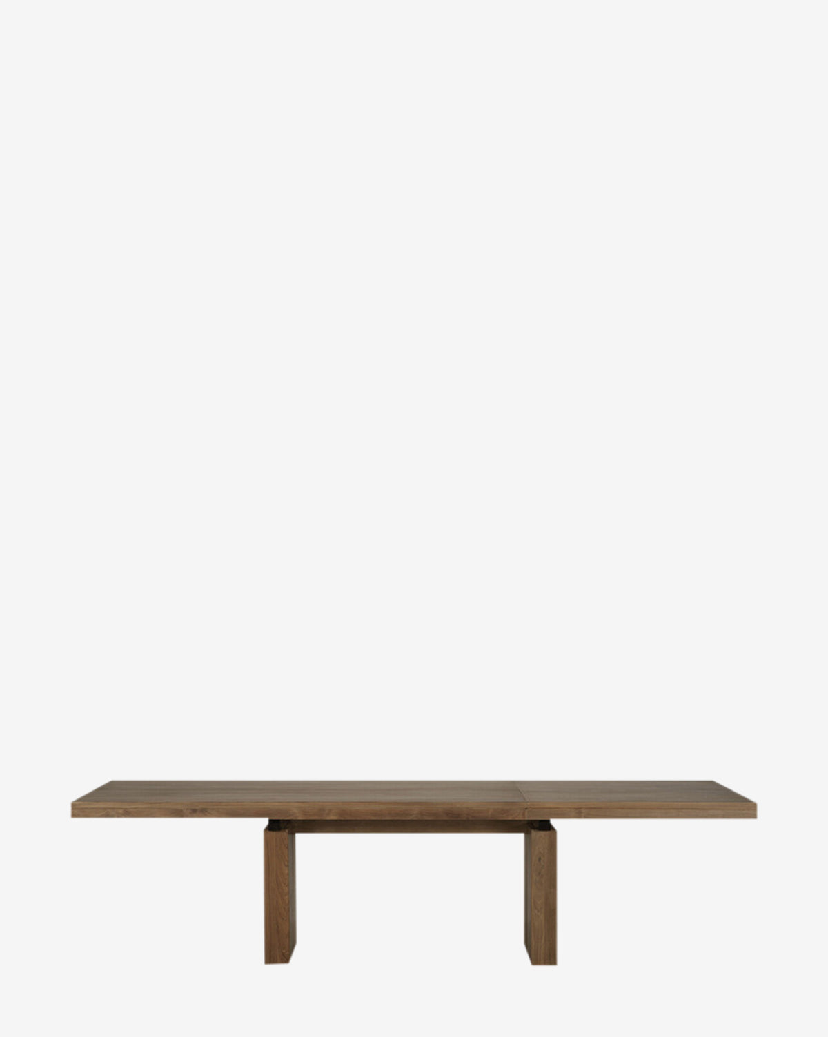 The Antoni Extension Dining Table is a modern rectangular solid wood table with a minimalist design, featuring a flat top and sturdy block legs, shown against a plain white background.