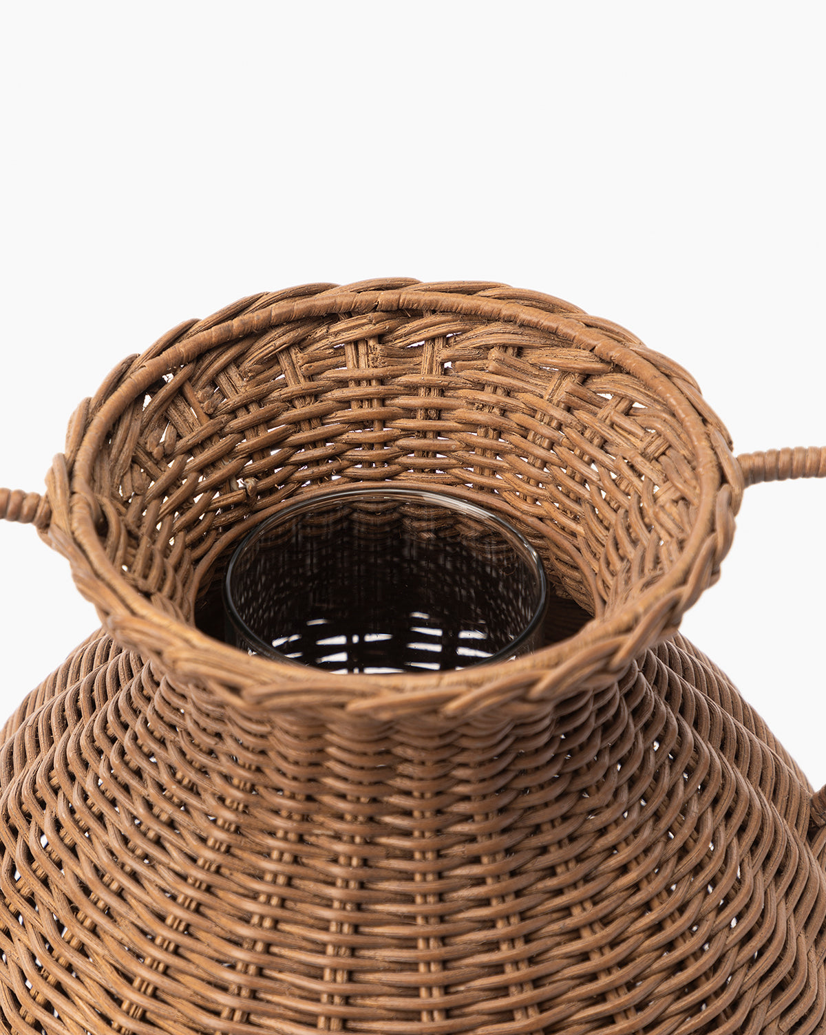 Close-up of the Antonia Woven Vase’s top, highlighting its wide opening, glass insert, detailed circular weave pattern, and two side handles.