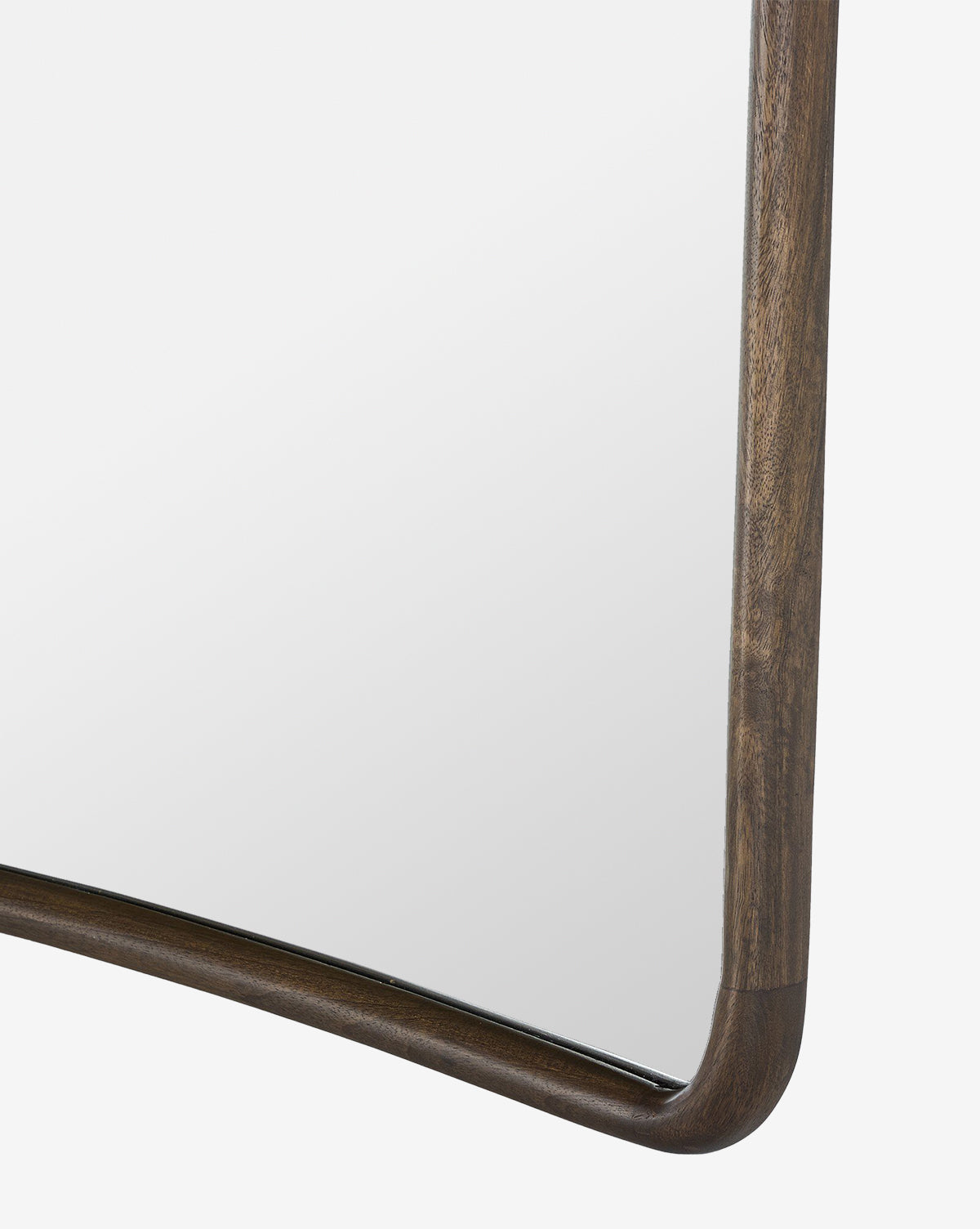 Close-up of the Arvid Wall Mirrors rectangular solid mango wood frame in an aged brown finish, highlighting the bottom-right corner against a white background, by McGee & Co.