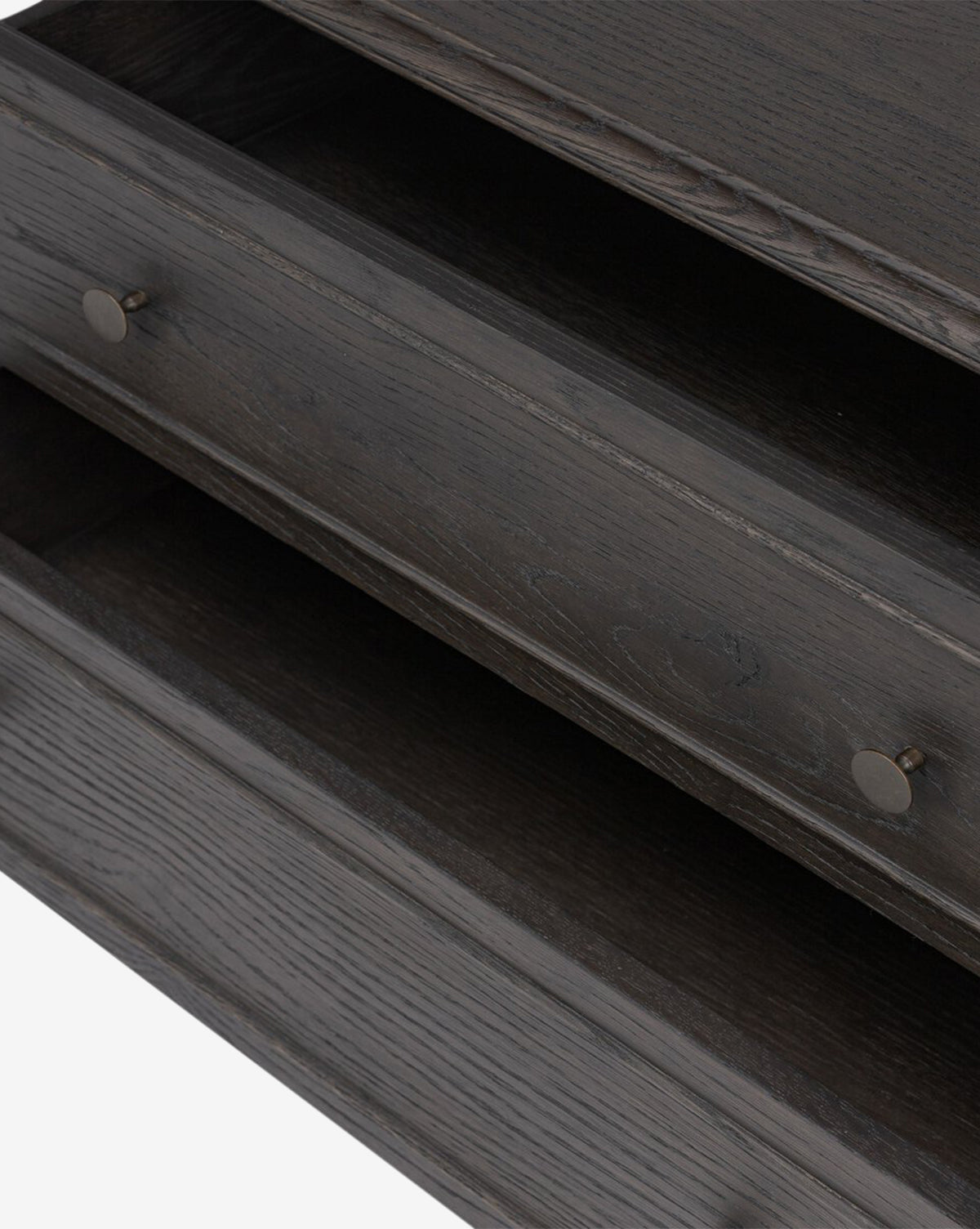 Close-up of two open Aurelian Nightstand smoked oak drawers with round metal knobs, showcasing their empty interiors, wood grain, and texture—ideal for adding stylish storage to your bedroom, by McGee & Co.