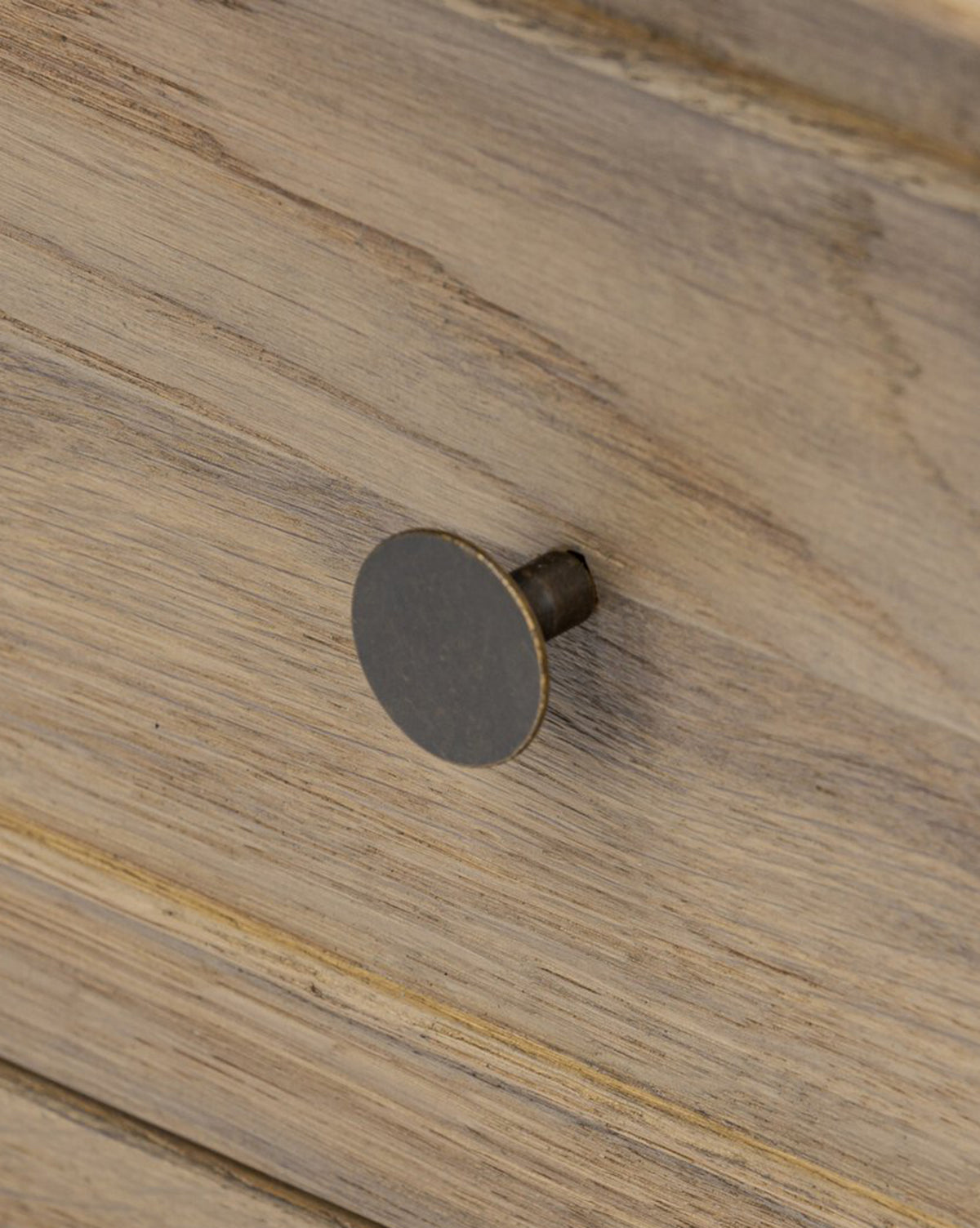 A close-up of the Aurelian Nightstands drawer highlights its simple round metal knob and light natural wood grain finish, making it an ideal choice for stylish bedroom storage, by McGee & Co.