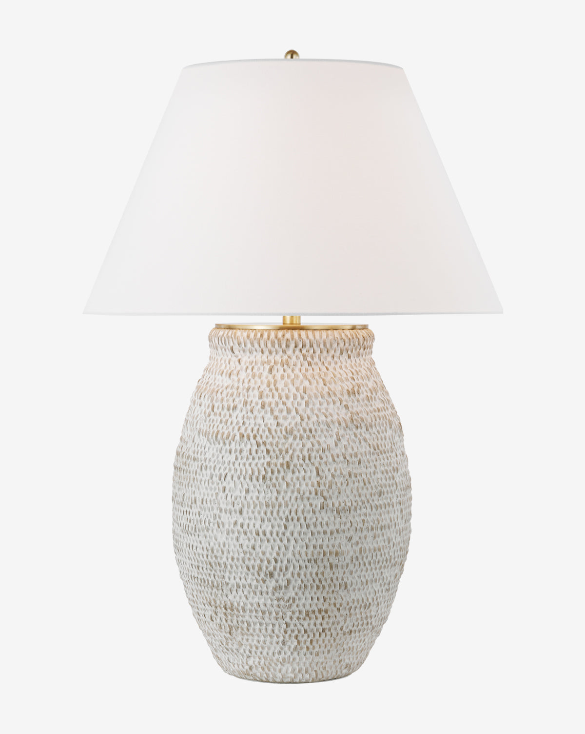 The Avedon Table Lamp features a white, textured ceramic base that looks like woven rattan and is topped with a wide white linen shade, shown against a plain white background by McGee & Co.