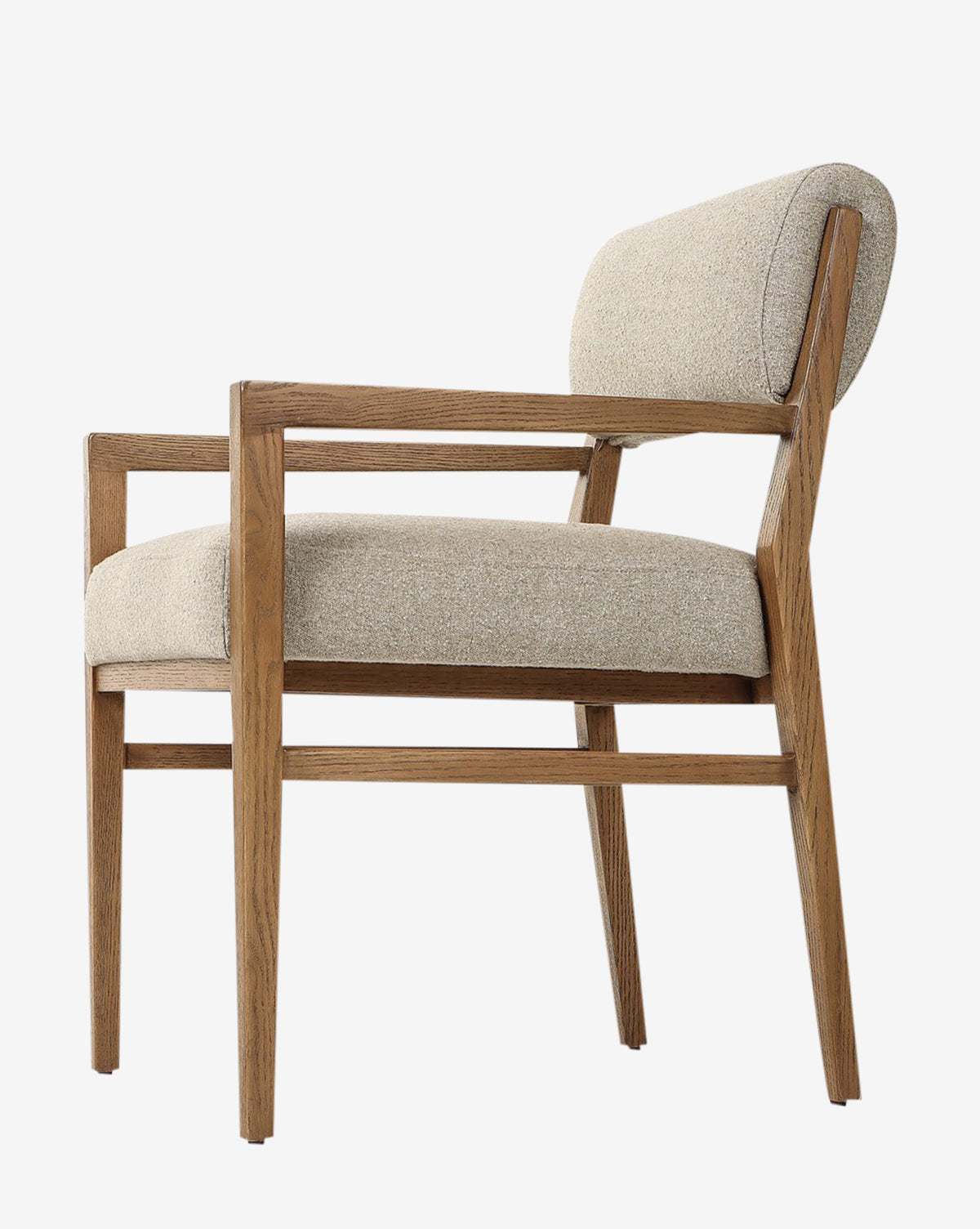 Side view of the Bailey Dining Arm Chair, featuring an upholstered beige seat, cushioned backrest, smoked oak frame, clean lines, and a minimalist design, by McGee & Co.