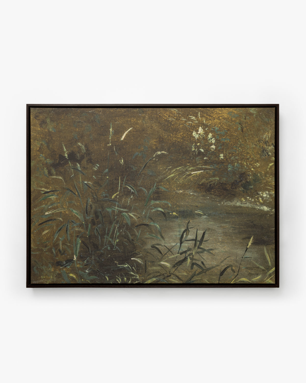 Bank Grasses is a gallery-wrapped giclee canvas painting depicting a tranquil pond bordered by tall grasses, with water reflecting lush foliage under gentle natural light, by McGee & Co.