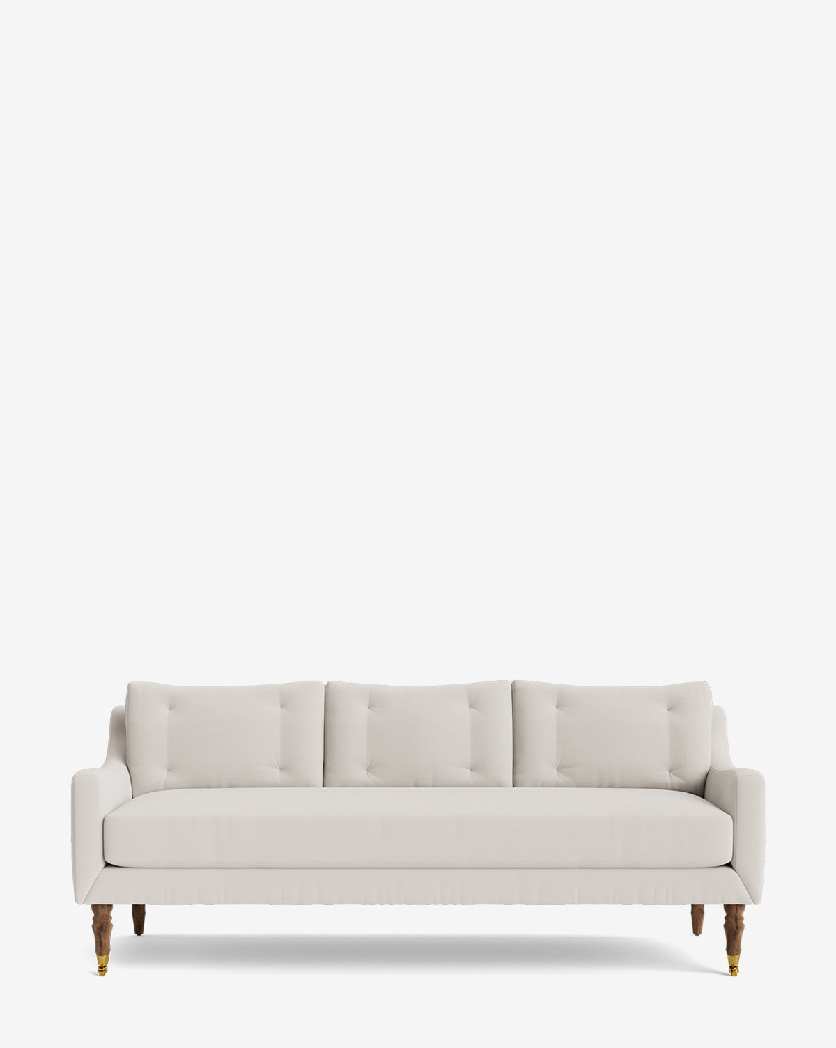 The Barden Sofa 84 showcases a modern light beige design with three back cushions, slim armrests, and reeded wood legs with brass caps, set against a plain white background by McGee & Co.