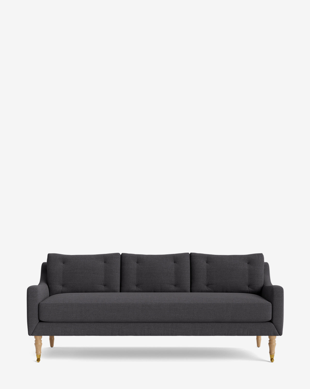 The Barden Sofa 84 is a modern dark gray three-seater with tufted cushions and reeded wood legs, shown on a plain white background by McGee & Co.