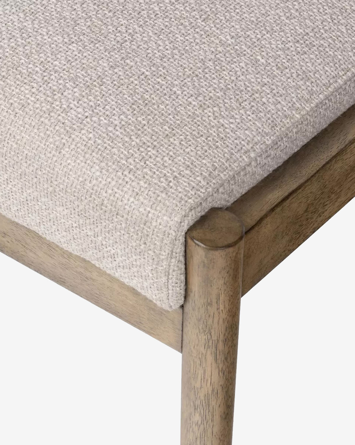 Close-up of the Bardot Dining Chair, highlighting its smooth parawood frame and light brown, high-performance fabric seat cushion with a natural finish, by McGee & Co.