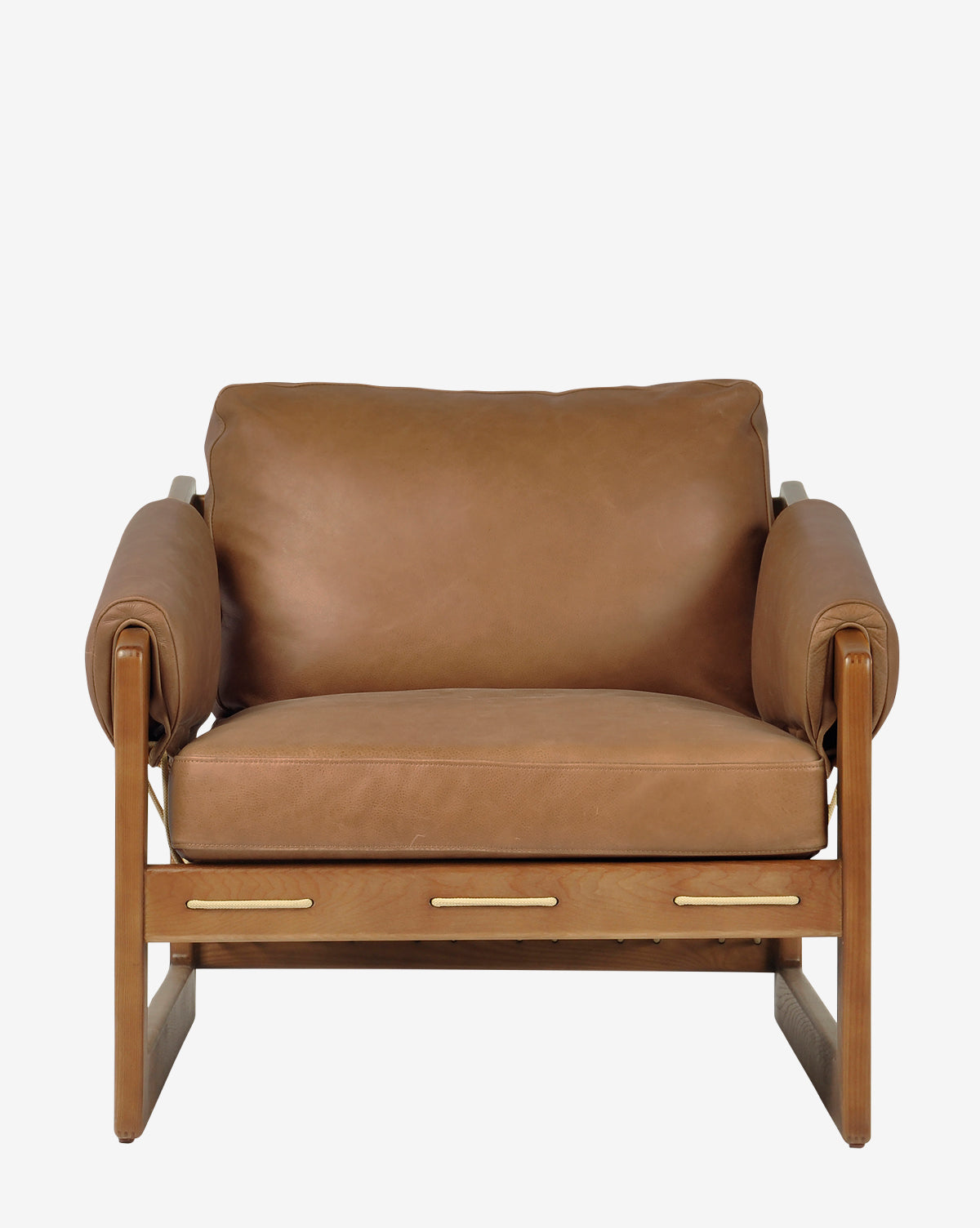 The Barker Lounge Chair features tan top-grain leather cushions, a wooden frame, wide armrests, and a sturdy minimalist design with midcentury inspiration, shown from the front against a plain white background by McGee & Co.