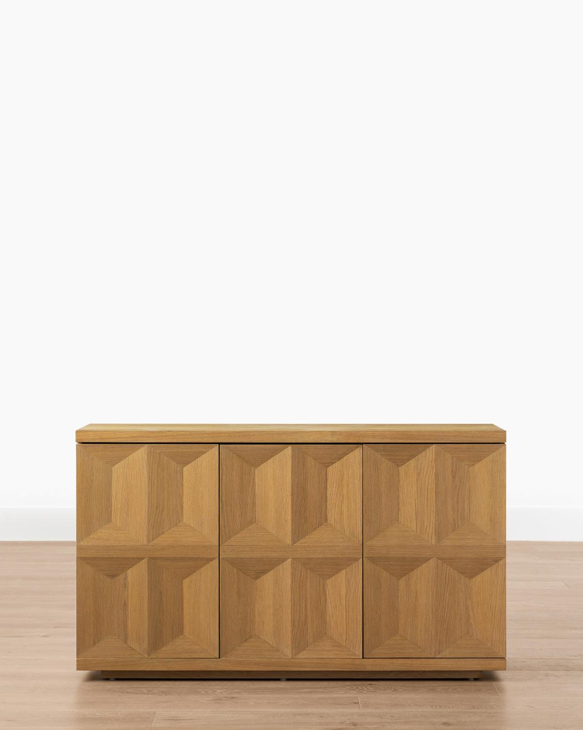 The Beacon 3-Door Sideboard showcases a bold geometric pattern on its doors and a neutral finish, bringing modern style to any room, by McGee & Co.