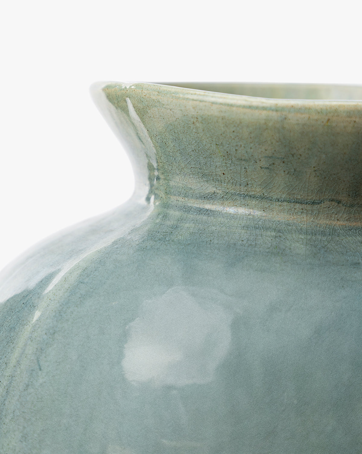 Close-up of the Beatrix Vase, a glossy pale blue-green ceramic with vintage crackle glaze details and handcrafted artistry, shown against a white background, by McGee & Co.