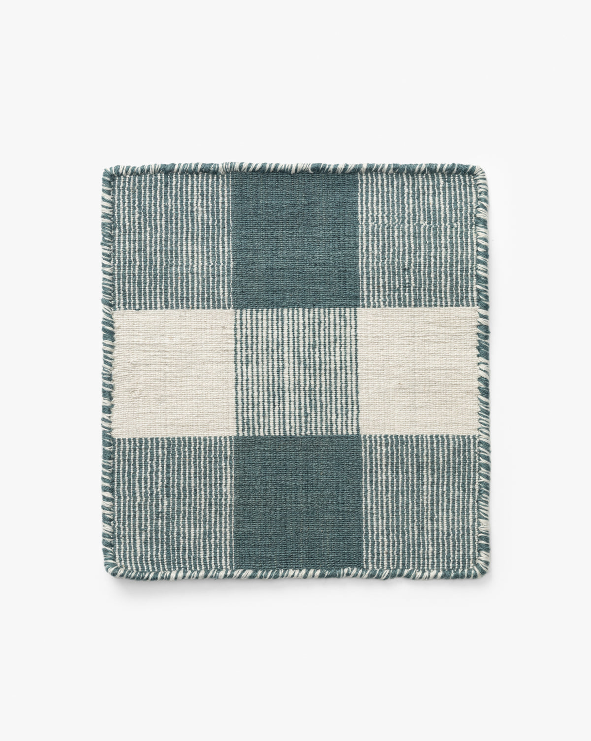 The Belleville Blue Indoor/Outdoor Rug Swatch is a square fabric sample in teal and off-white with a checkered pattern, alternating striped and solid textures, plus stitched fringe edges inspired by classic rug motifs, by McGee & Co.