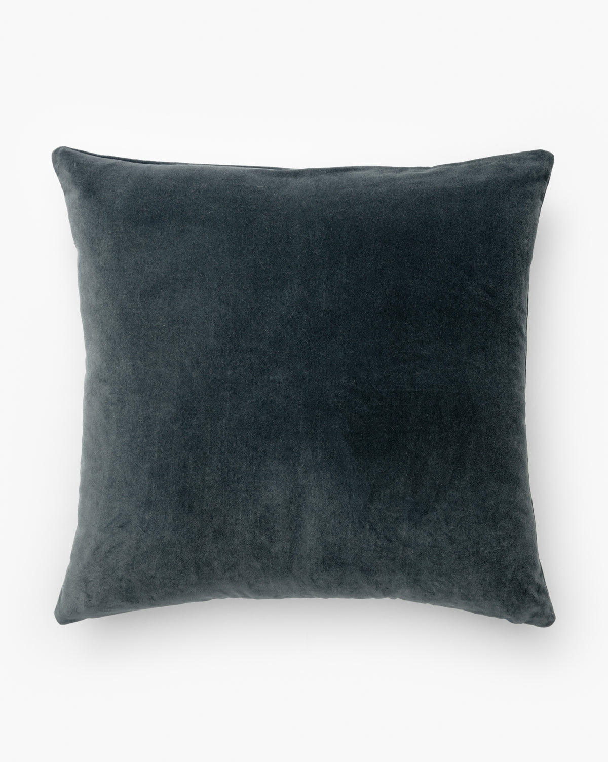 A square, dark gray Bellevue Velvet Pillow Cover with a soft blue stone-washed texture by McGee & Co.