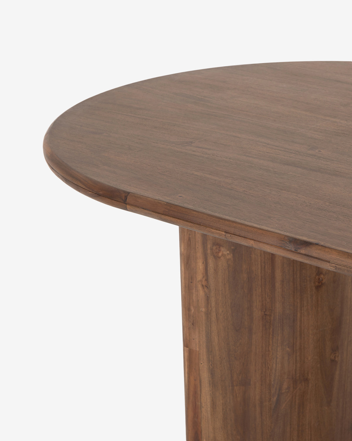 Close-up of the Belvedere Dining Table’s solid wood corner, showcasing its smooth surface and natural grain, with the tabletop edge and leg visible against a white background, by McGee & Co.