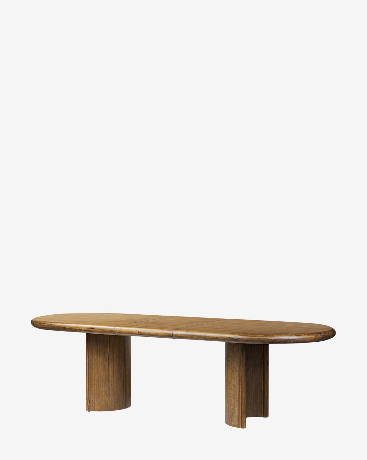 The Belvedere Extension Dining Table features an oval acacia wood top and two wide pedestal legs, displayed against a plain white background by McGee & Co.