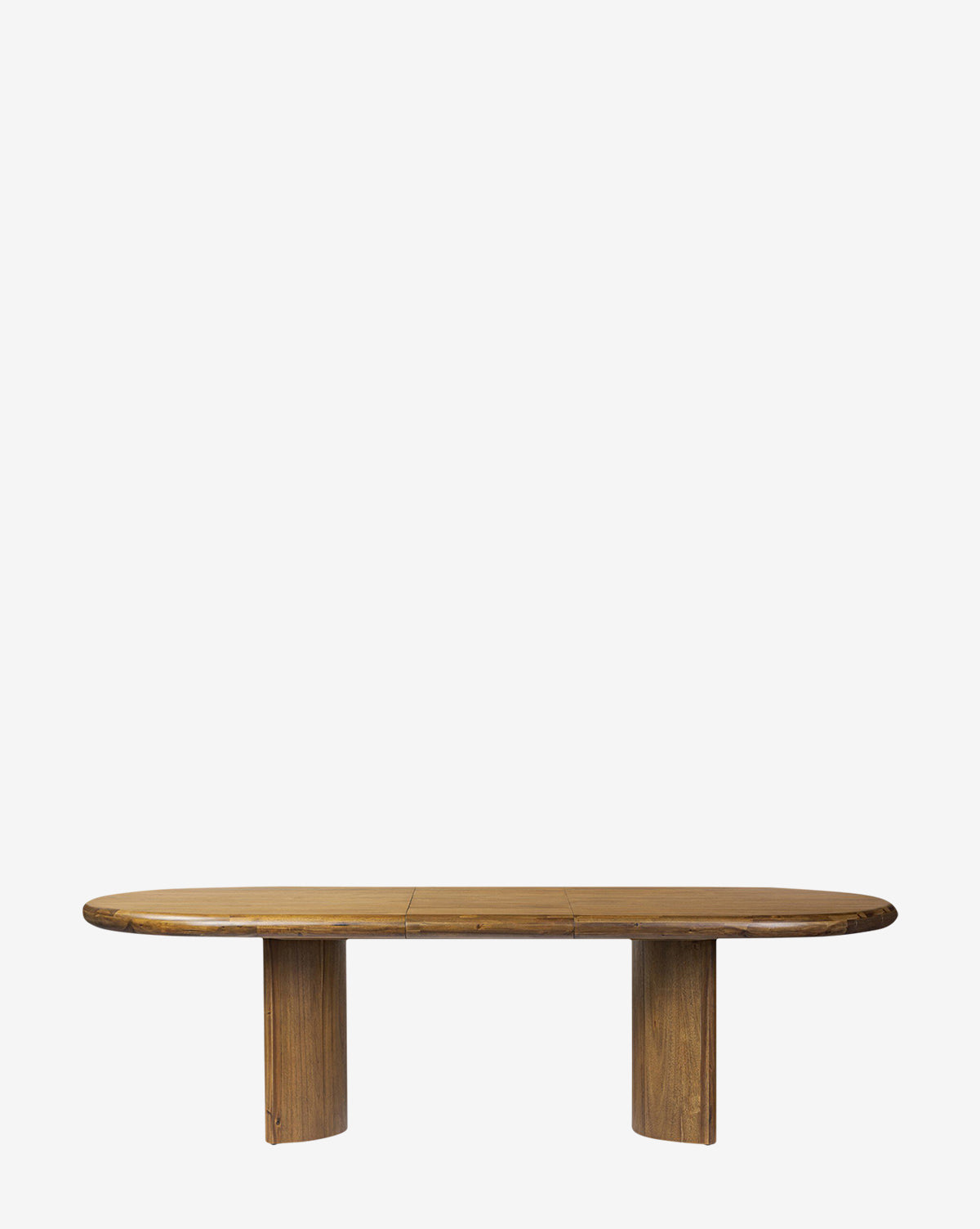 The Belvedere Extension Dining Table features a large, oval acacia wood top with two wide rectangular pedestal legs, shown against a plain white background by McGee & Co.