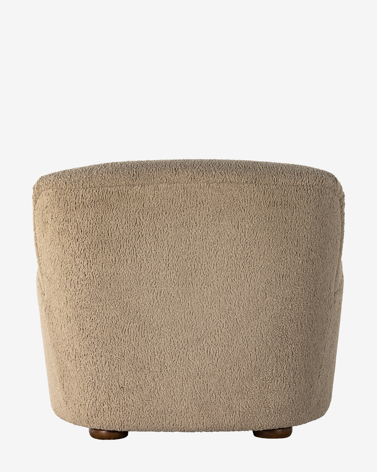 The Berrett Chaise Lounge, featuring beige plush shearling upholstery, a rounded backrest, and small wooden legs, is shown from behind against a white background—a cozy, textured accent for any living space, by McGee & Co.