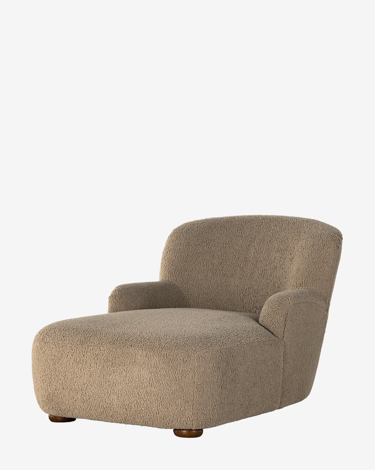 The Berrett Chaise Lounge features a modern, low-profile design with a rounded back and arms, upholstered in textured beige fabric that mimics shearling—an ideal addition to any cozy living space, by McGee & Co.