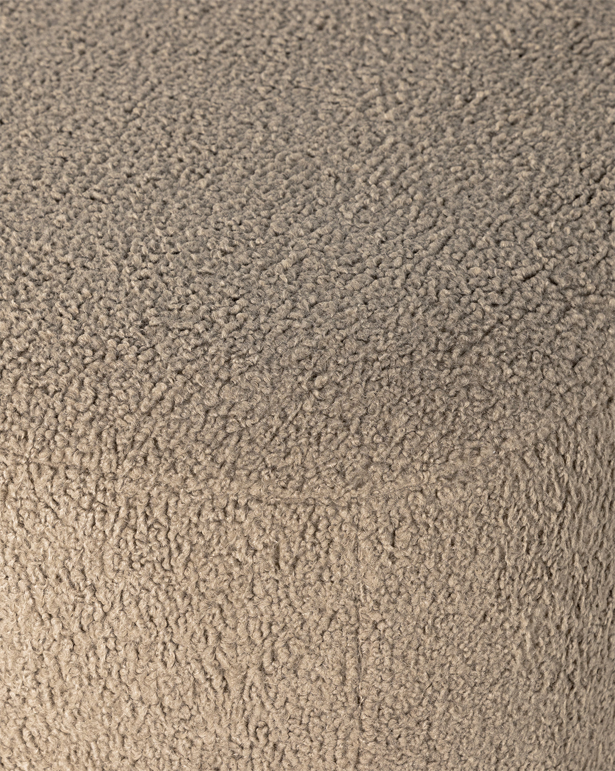 Close-up of the Berrett Chaise Lounges textured beige upholstery, featuring soft, fuzzy sherpa-like fabric with visible loops and fibers—perfect for adding warmth and comfort to your living space, by McGee & Co.
