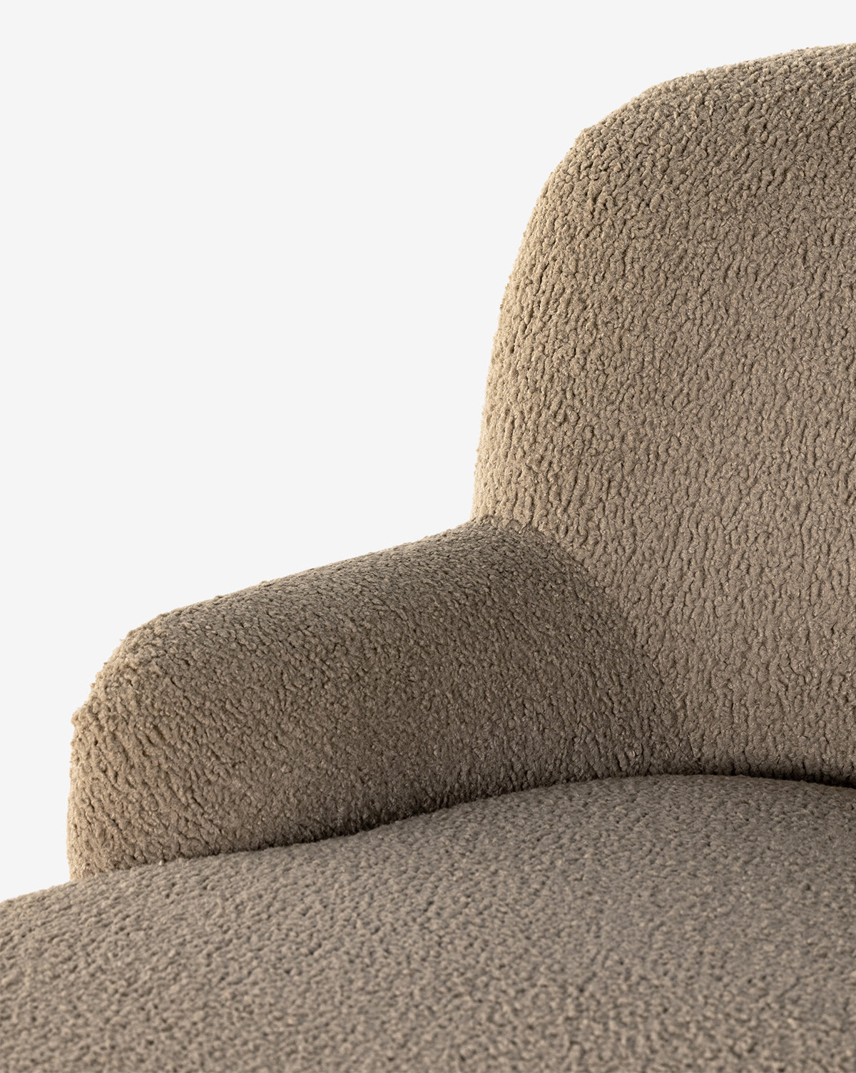 Close-up of the Berrett Chaise Lounge with textured beige shearling upholstery, showcasing the seat, armrest, and backrest against a white background—ideal for enhancing any living space, by McGee & Co.