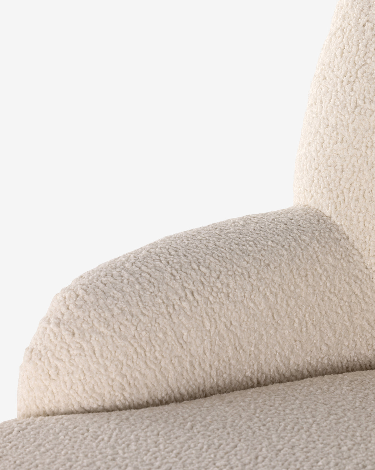 Close-up of the Berrett Chaise Lounge in beige boucle fabric, showcasing its armrest and backrest against a white background—an inviting addition to any living space, by McGee & Co.