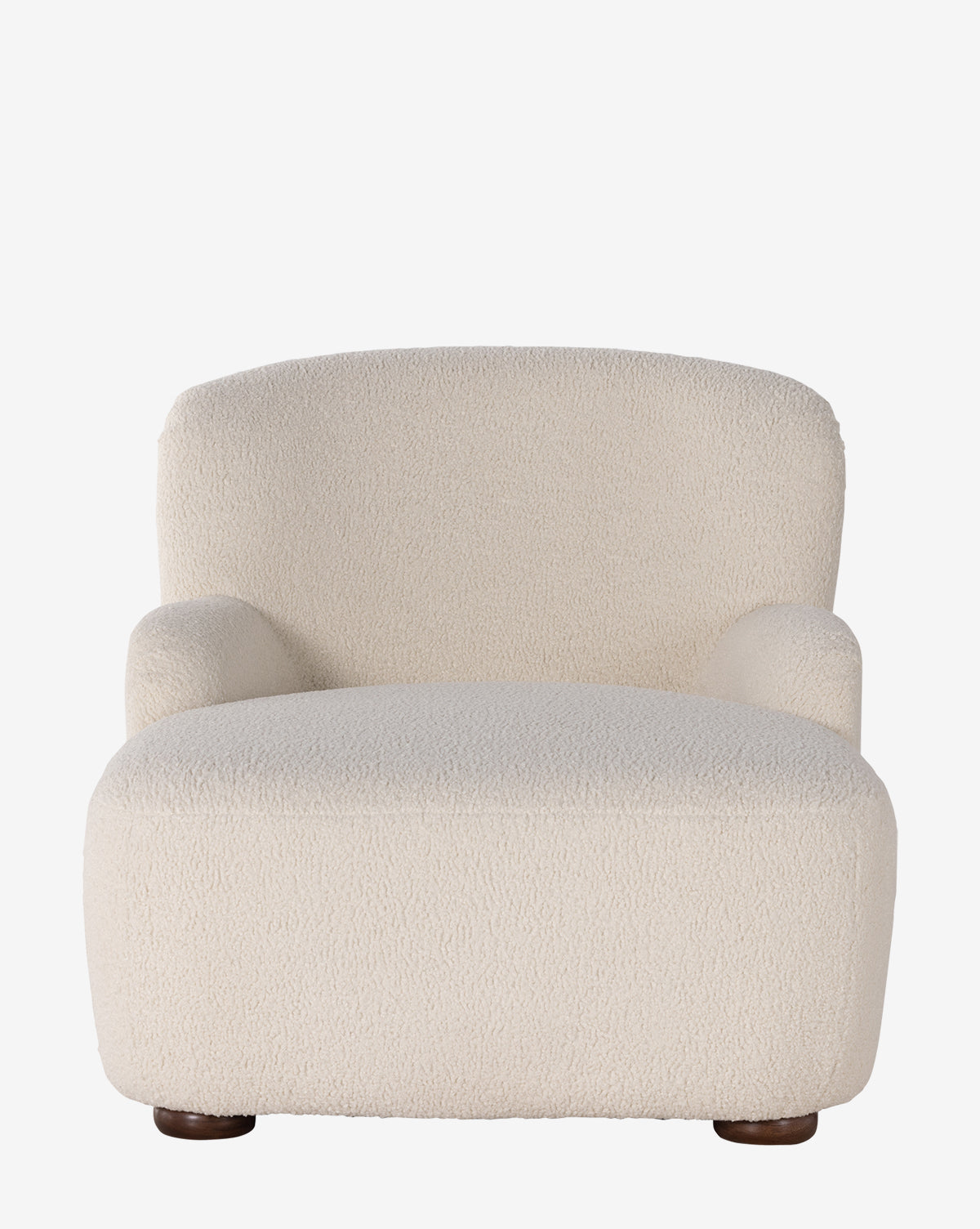 The Berrett Chaise Lounge is a plush, modern seat upholstered in textured off-white shearling with rounded arms, a low wide seat, and short dark wood legs—perfect for elevating any living space, by McGee & Co.