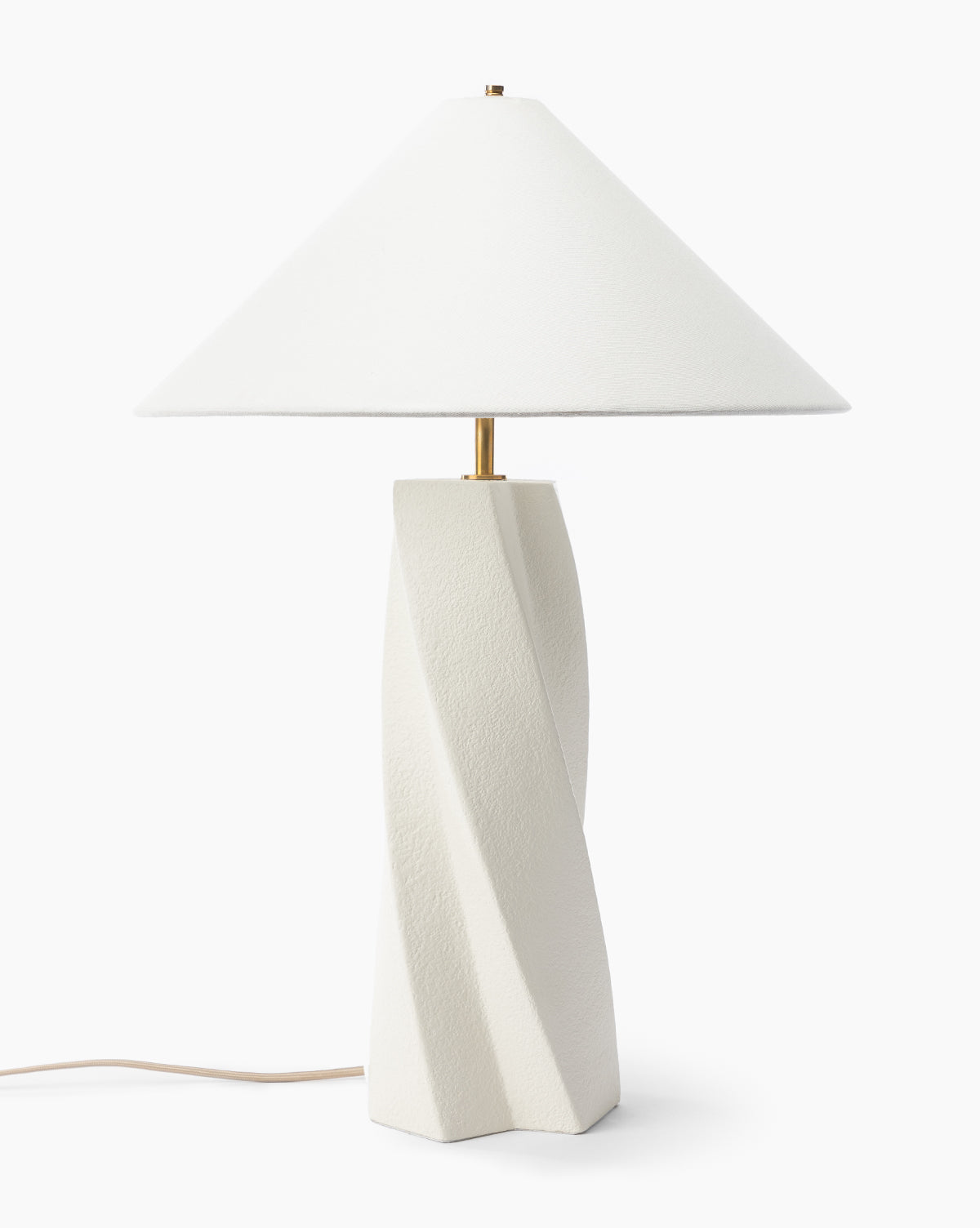 The Bettencourt Table Lamp features a minimalist, elegant design with a textured, twisted white resin base, a wide linen shade, and an electrical cord extending from the base, by McGee & Co.